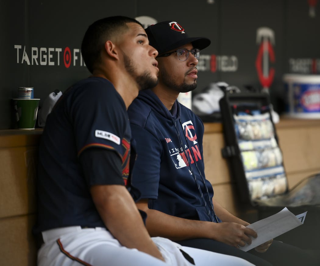 Jose Berrios, left, talked through a scouting report with Elvis Martinez.