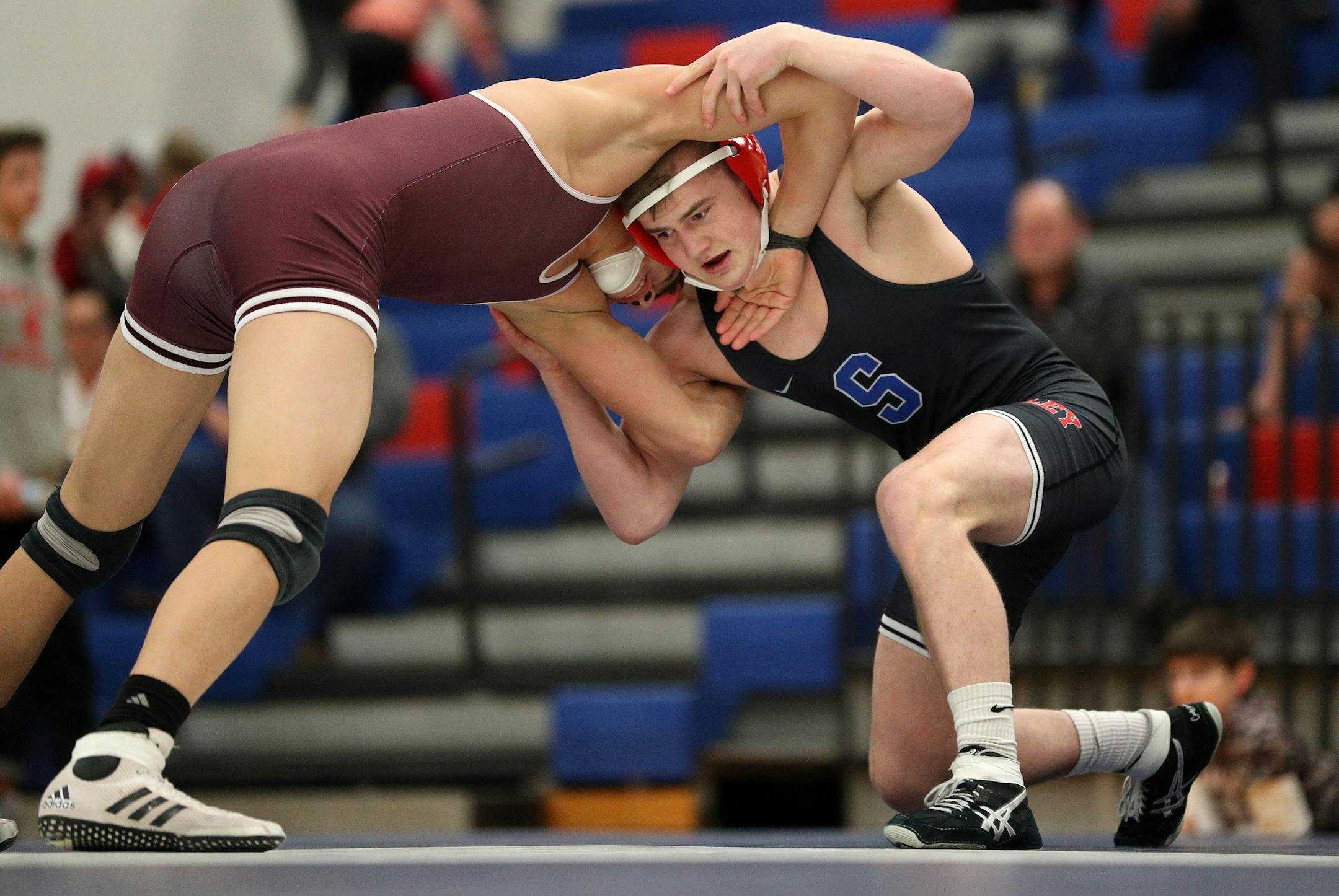 Simley's Jake Gliva wrestles South St. Paul's Antonio Cortez Saturday. ] ANTHONY SOUFFLE • anthony.souffle@startribune.com Action from Simley High School competing against South St. Paul High School in the Class 2A, Section 4 tournament Saturday, Feb. 18,2017 in Invere Grove Heights, Minn.