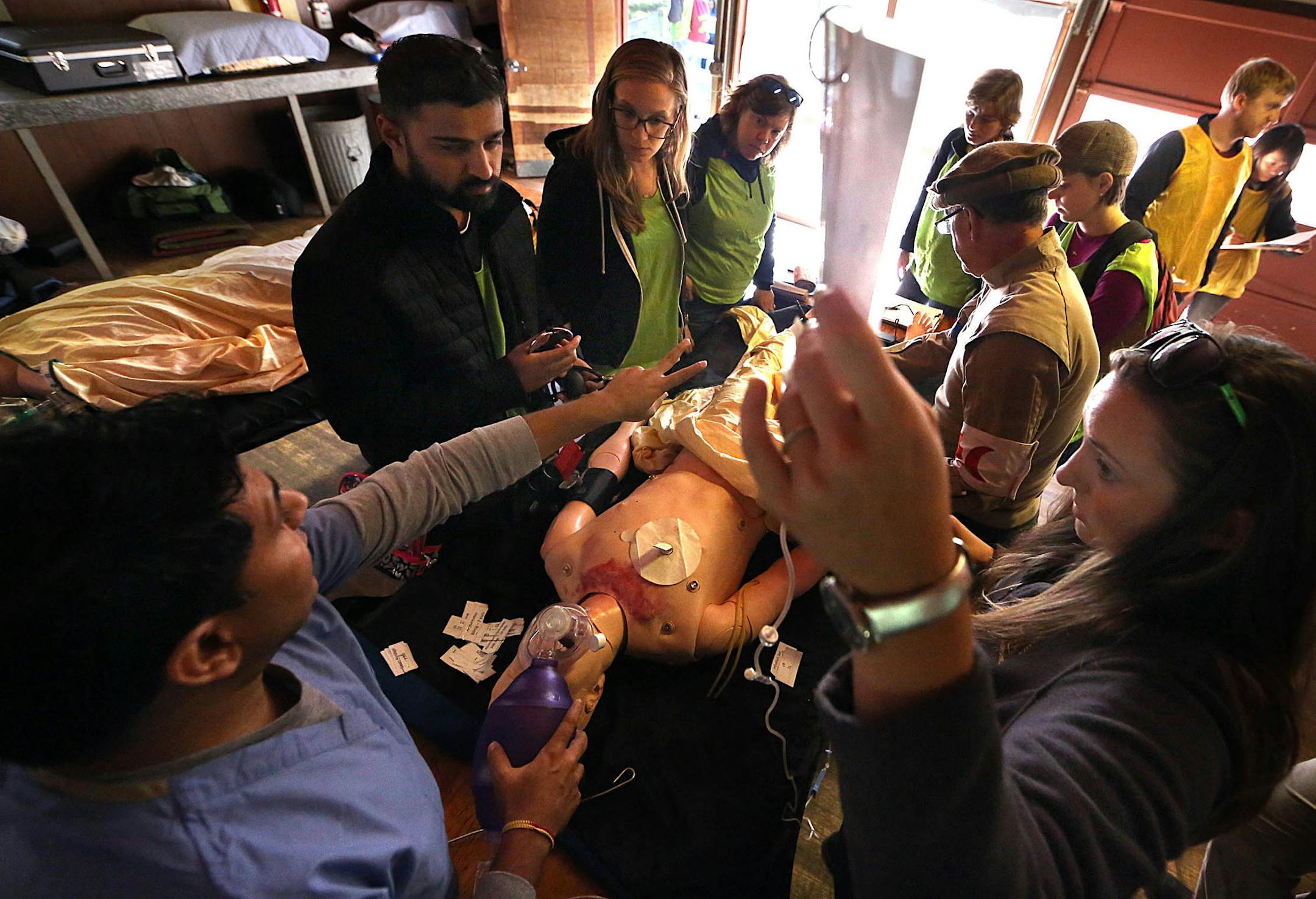 Dr. Rahul Kashyap, left, works at Mayo Clinic in real life, and used his knowledge and experience to lead the simulated treatment of a refugee with the help of relief workers.