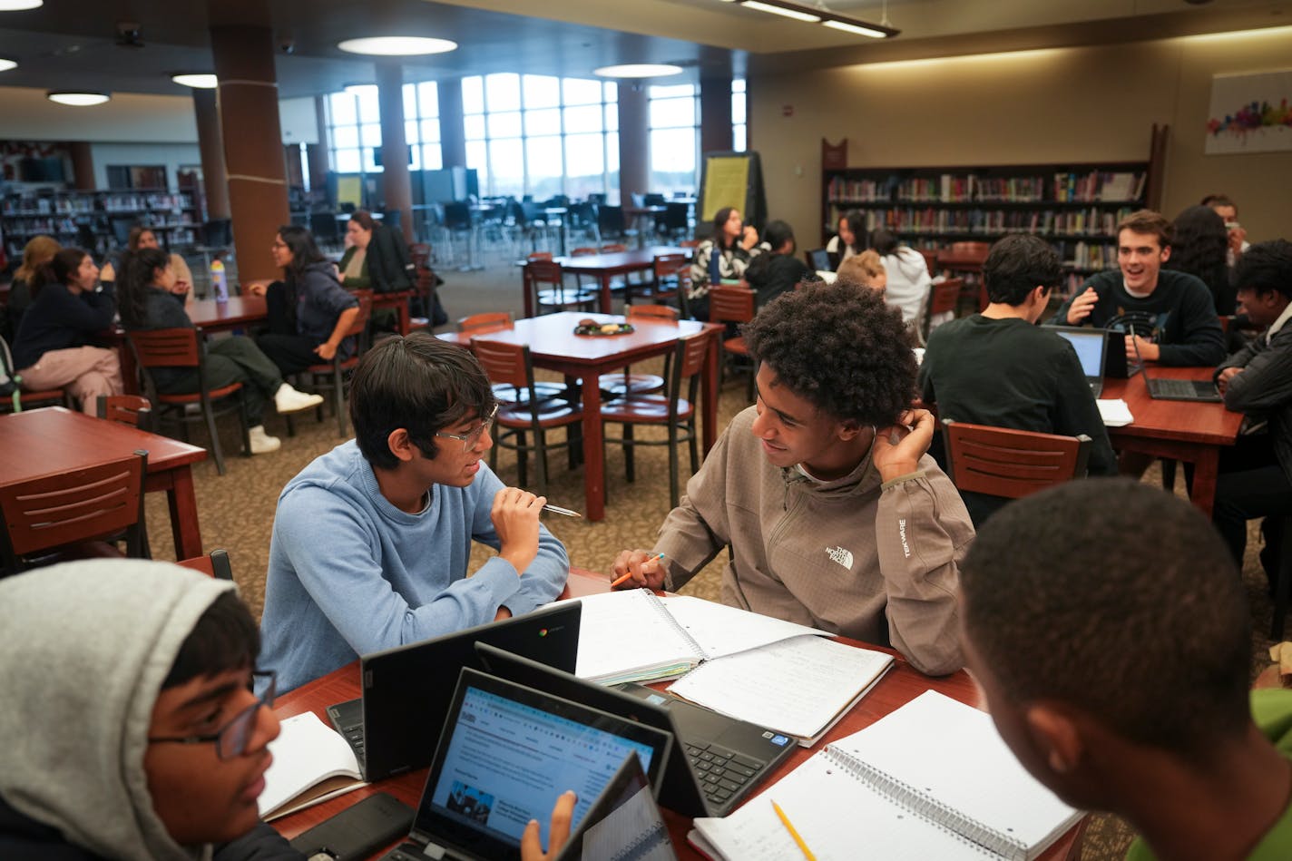 Yashas Singh, 15, and Aman Lulseged, 17, discuss their AP economics notes in an after school peer tutoring program at East Ridge High School on Monday, Nov. 6, 2023 in Woodbury, Minn. ] RENEE JONES SCHNEIDER • renee.jones@startribune.com