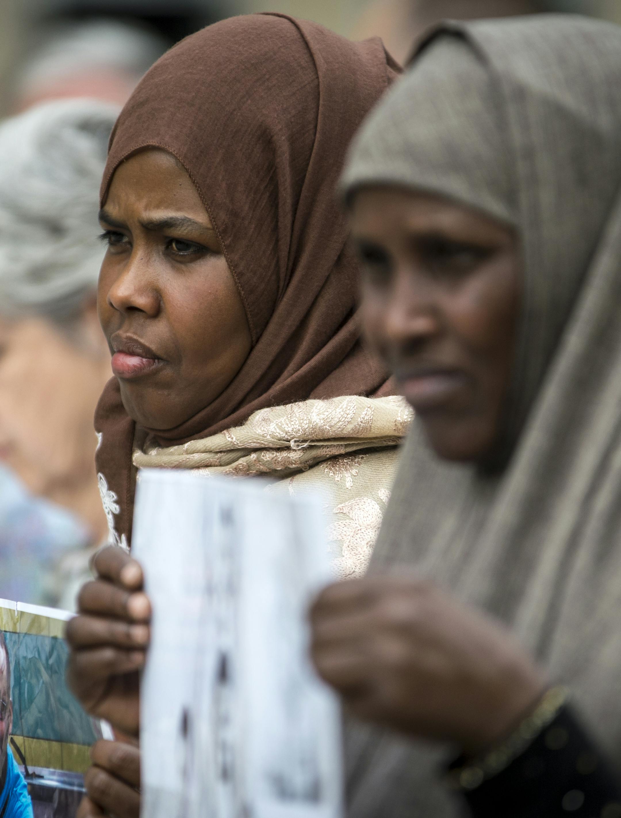 Ayan Farah, mother of Mohamed Abdihamid Farah, center, and Fadumo Hussein, mother of Guled Ali Omar, took part in a demonstration outside of the US Federal Courthouse Tuesday in support of their sons. Omar and Farah are two of the three young Somali men on trial for attempting to join ISIL. ] (AARON LAVINSKY/STAR TRIBUNE) aaron.lavinsky@startribune.com Closing arguments began Tuesday in the federal ISIL recruit trial in Minneapolis, now in its fourth week. The government will argue its case firs