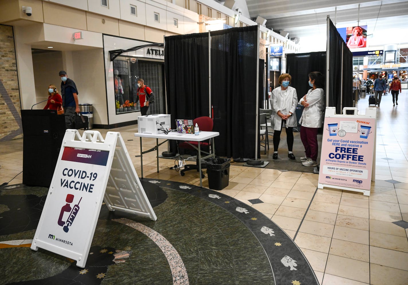 Homeland Health nurses Patricia Markus and Cindy McCabe, right, waited for potential patients in the COVID-19 pop-up vaccination clinic at MSP's Terminal 1 Tuesday afternoon.