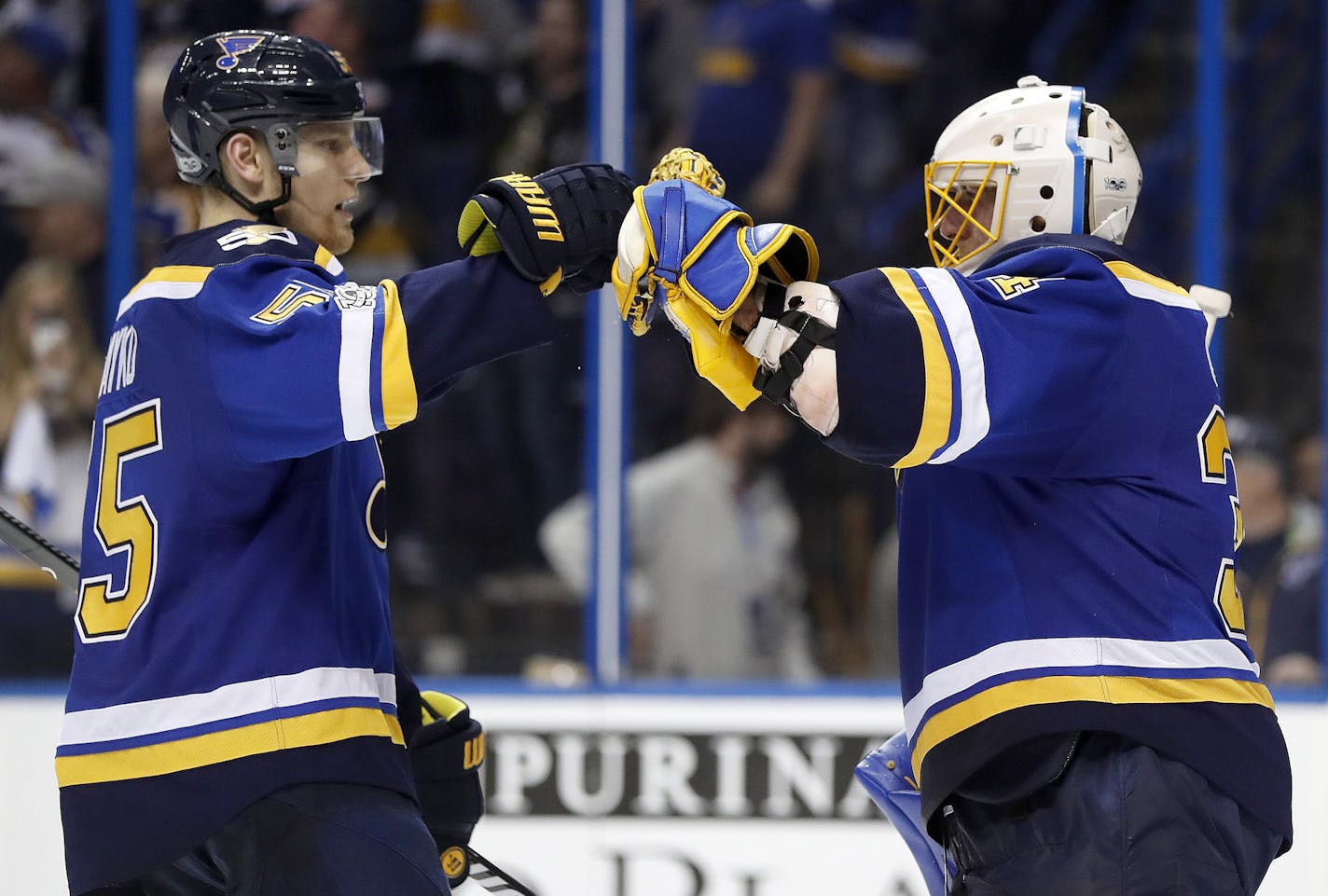 St. Louis Blues goalie Jake Allen, right, celebrates with Colton Parayko after the Blues' 3-1 victory over the Minnesota Wild in Game 3 of an NHL hockey first-round playoff series, Sunday, April 16, 2017, in St. Louis. The Blues won 3-1. (AP Photo/Jeff Roberson)