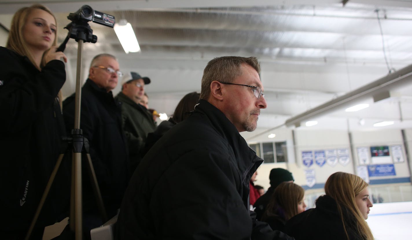 East Ridge goalie coach Mike Moline watched the action on the ice as his team played against East Ridge in the third period. ] (KYNDELL HARKNESS/STAR TRIBUNE) kyndell.harkness@startribune.com Park of Cottage Grove vs. East Ridge at Bielenberg Sports Complex in Woodbury Min., Saturday, December 27, 2014.