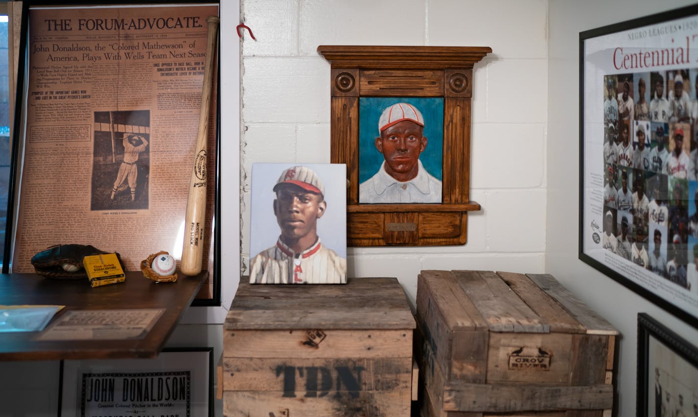 Pete Gorton's mission is to uncover the history and share the story of Negro League pitching great John Wesley Donaldson. Here he held a copy of a painting of Donaldson when he played with the 1915 All Nations Team which played throughout the upper Midwest, center.