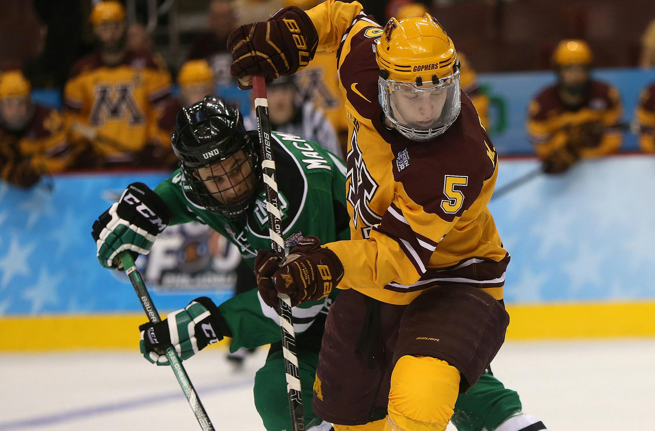 Gophers defenseman Mike Reilly, battling North Dakota's Mark MacMillan during Minnesota's 2014 Frozen Four victory, picked the Wild over other NHL teams, including Pittsburgh and Chicago. "When it came down to it, I just felt comfortable with Minnesota,'' Reilly said.