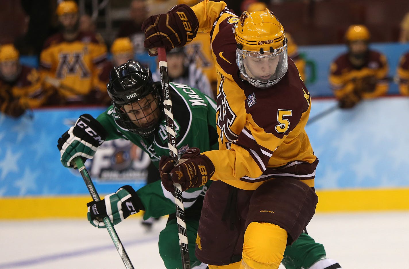 Gophers defenseman Mike Reilly, battling North Dakota's Mark MacMillan during Minnesota's 2014 Frozen Four victory, picked the Wild over other NHL teams, including Pittsburgh and Chicago. "When it came down to it, I just felt comfortable with Minnesota,'' Reilly said.