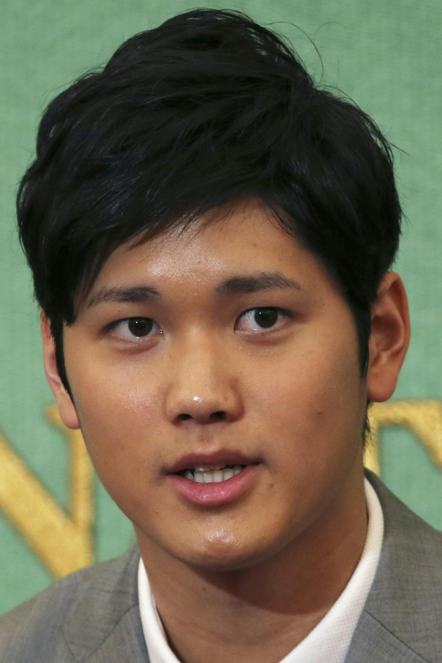 Japanese pitcher-outfielder Shohei Otani speaks during a press conference at Japanese National Press Center in Tokyo, Saturday, Nov. 11, 2017. Otani announced on Saturday he wants to move to Major League Baseball next season. (AP Photo/Koji Sasahara)