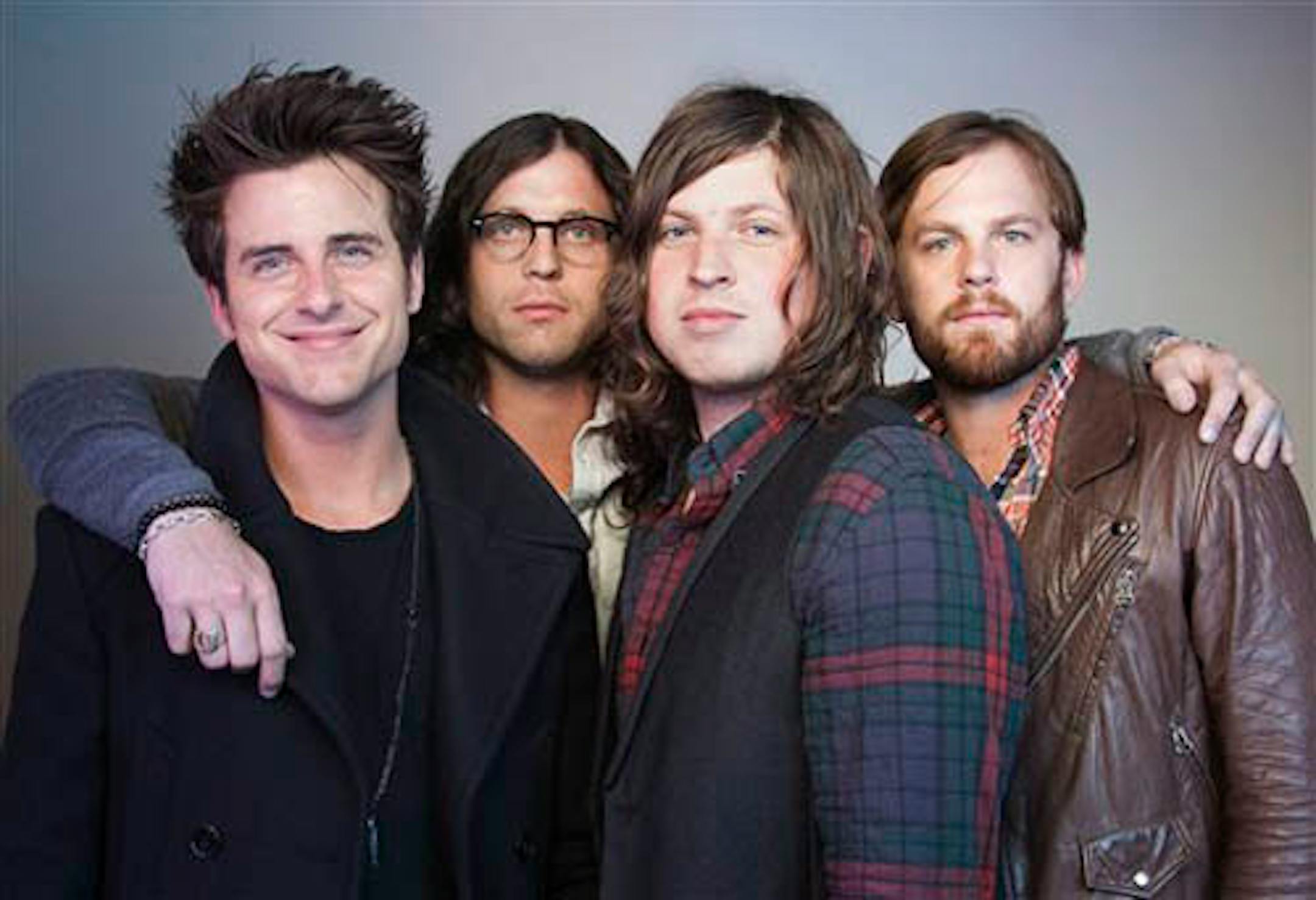 FILE - In this Oct. 21, 2010 file photo, members of the band Kings of Leon, from left, Jared Followill, Nathan Followill, Matthew Followill and Caleb Followill, pose for a portrait in New York. The Kings of Leon promised Sunday, July 31, 2011, to make it up to their Dallas fans after they canceled a show when their lead singer complained it was too hot to perform. In a statement, the band announced plans to return to Dallas on Sept. 21. (AP Photo/Victoria Will, File)