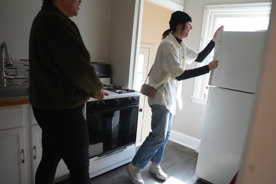 Lakes Area Realty's Mackenzie Owens, left, shows a south Minneapolis home to first-time home buyer Nicole Neumann on March 12, 2024.