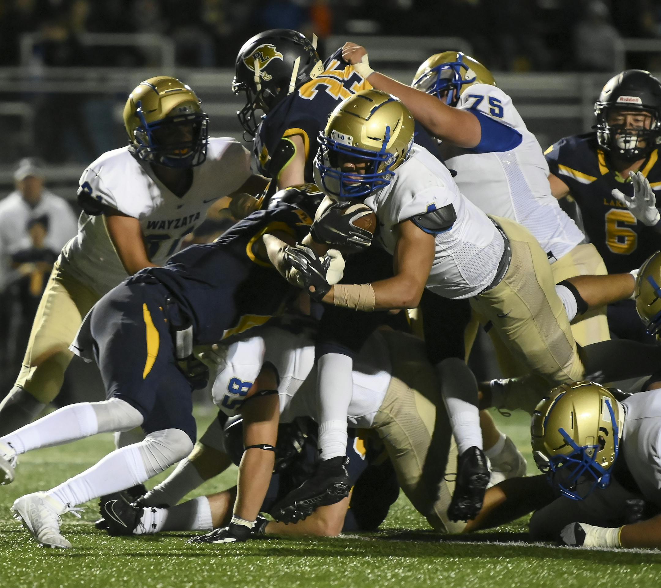 Wayzata running back Christian Vasser (4) jumped into the end zone for the game-winning touchdown in the fourth quarter against Prior Lake. ] Aaron Lavinsky • aaron.lavinsky@startribune.com Prior Lake played Wayzata in a high school football game on Friday, Sept. 13, 2019 at Prior Lake High School in Savage, Minn.