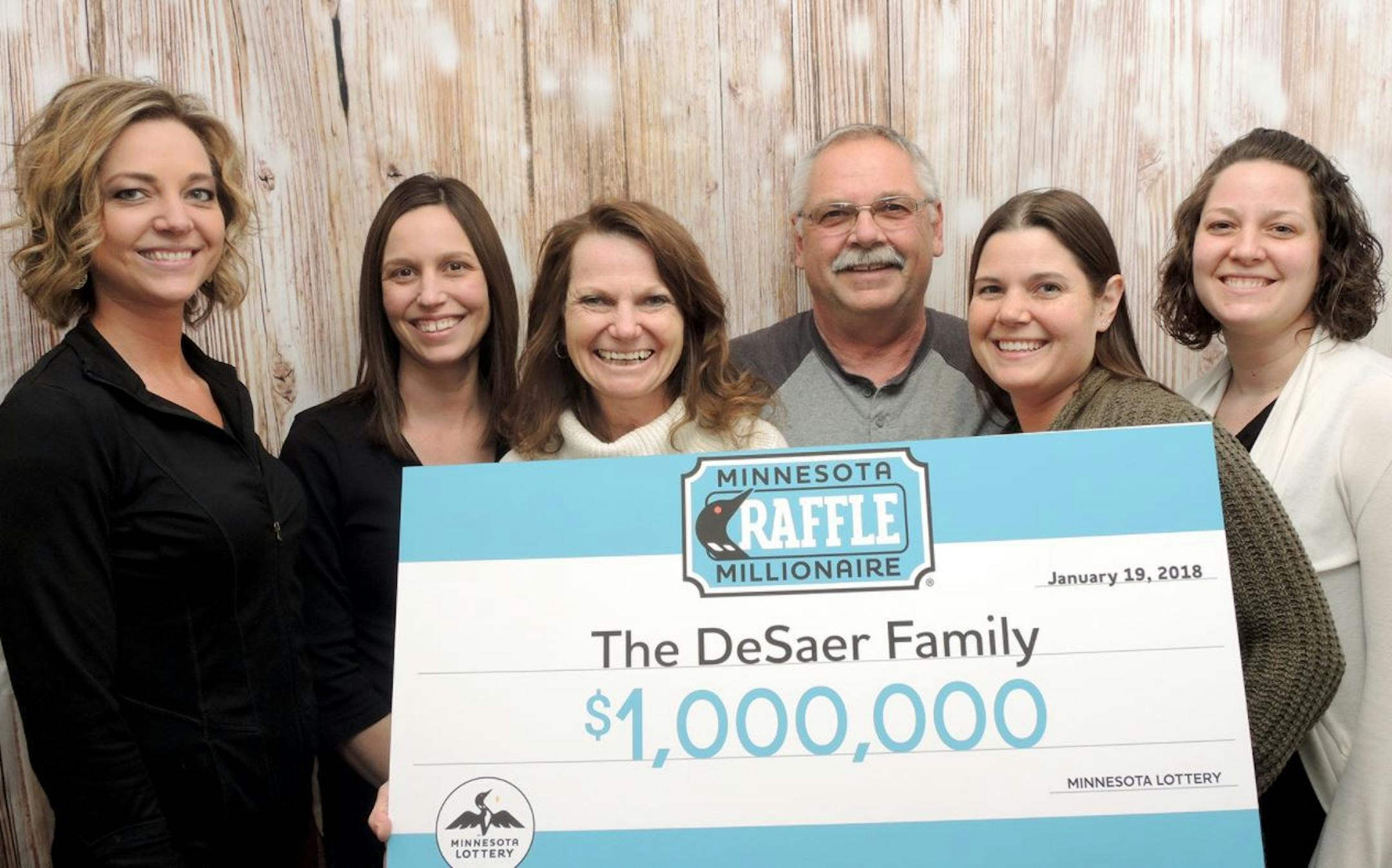 Don and Phyllis DeSaer displayed winning smiles with their four daughters.