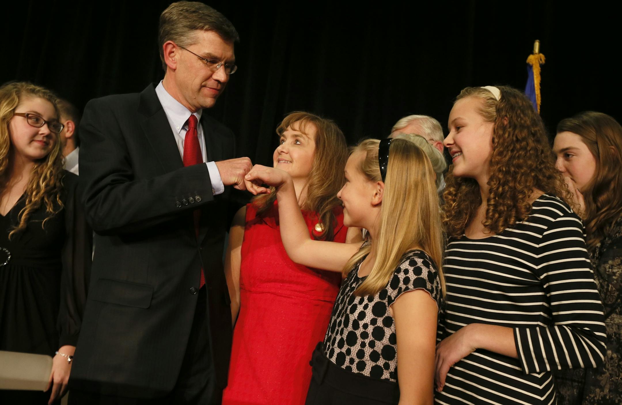 On stage with his family, Erik Paulsen got a fist bump from his daughter, Liesel, on election night at the Hilton Minneapolis.