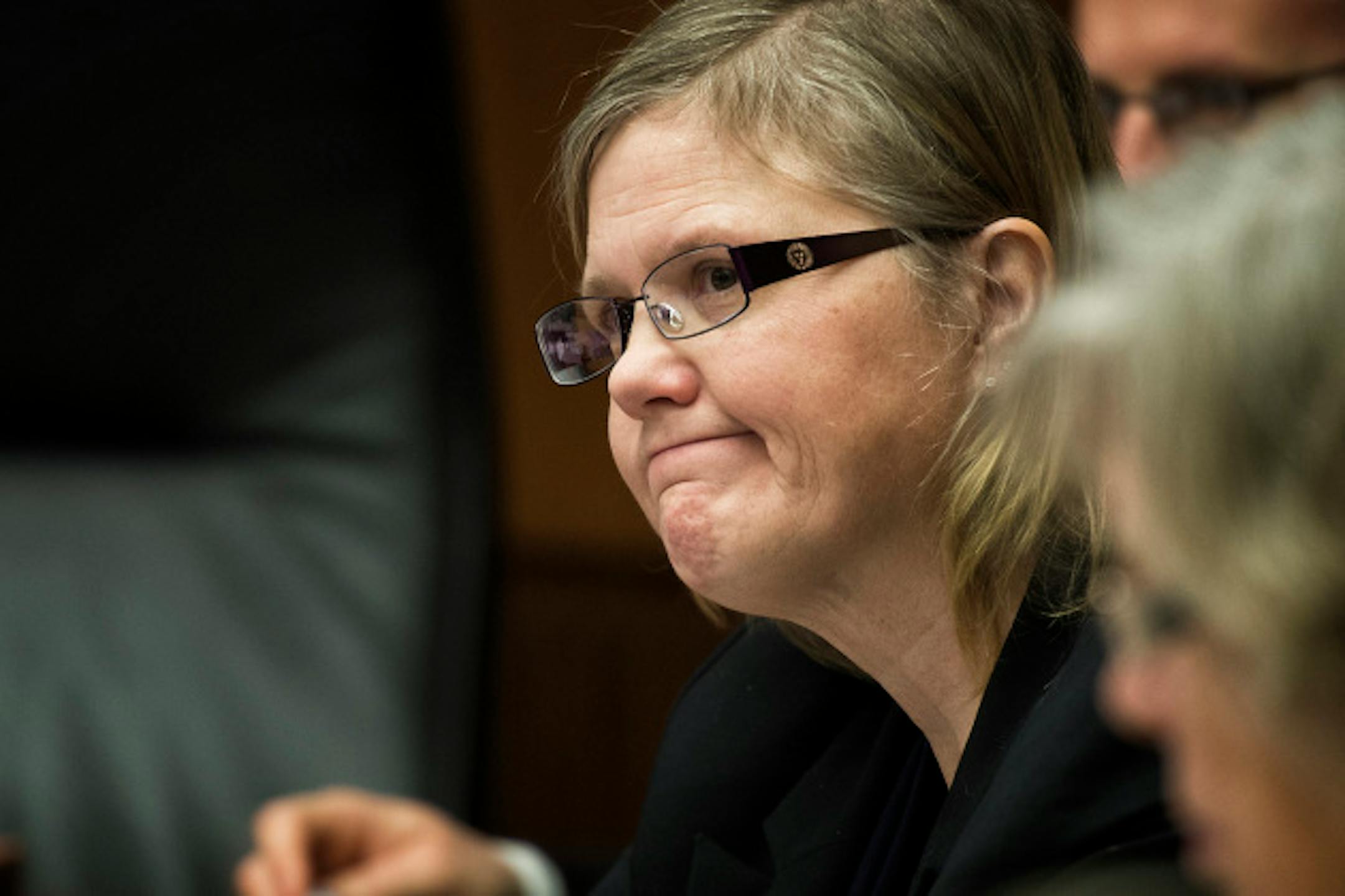 DFL Rep. Debra Hilstrom listened at DFL Rep. Michael Paymar defended his background check bill.  Hilstrom is the author of the compromise bill that does not have the background check provision.   Supporters of universal background checks for guns faced a stiff test in House public safety committee Tuesday, March 19, 2013.  The bill containing background checks may not have the votes, and the sponsor is seeking a last-minute compromise to keep the concept alive.    ]   GLEN STUBBE * gstubbe@startribune.com