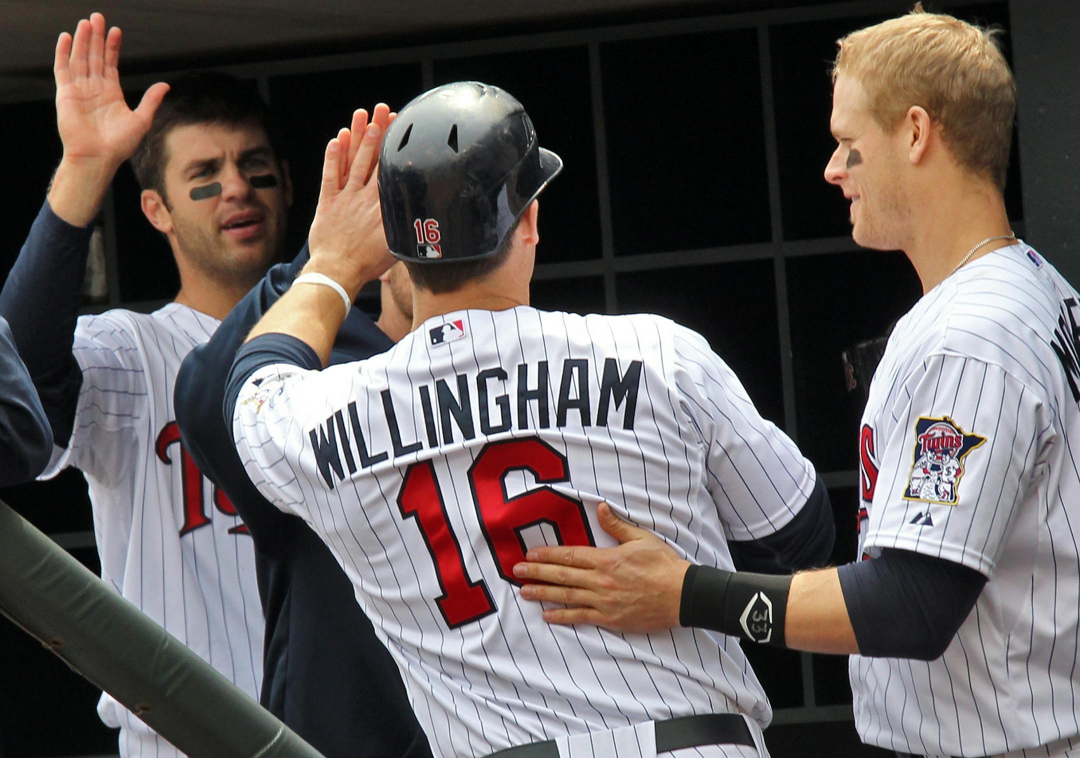 Josh Willingham was congratulated by teammates after scoring in the third inning Sunday.
