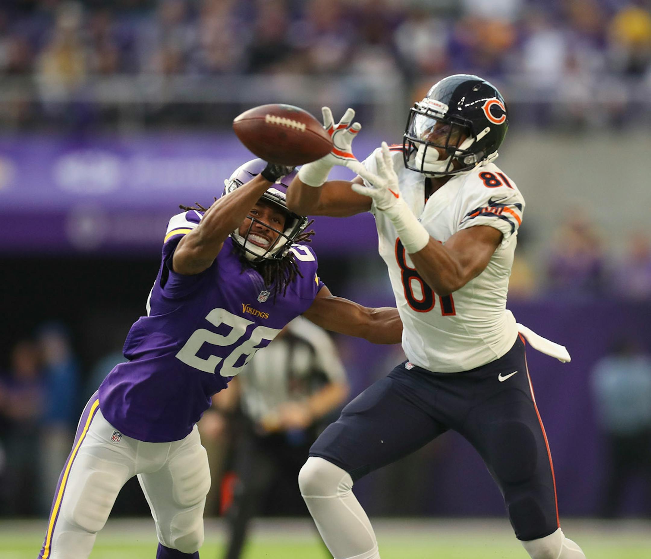 Chicago Bears wide receiver Cameron Meredith (81) caught a pass in front of Vikings cornerback Trae Waynes (26) in the fourth quarter for a 12 yard gain.