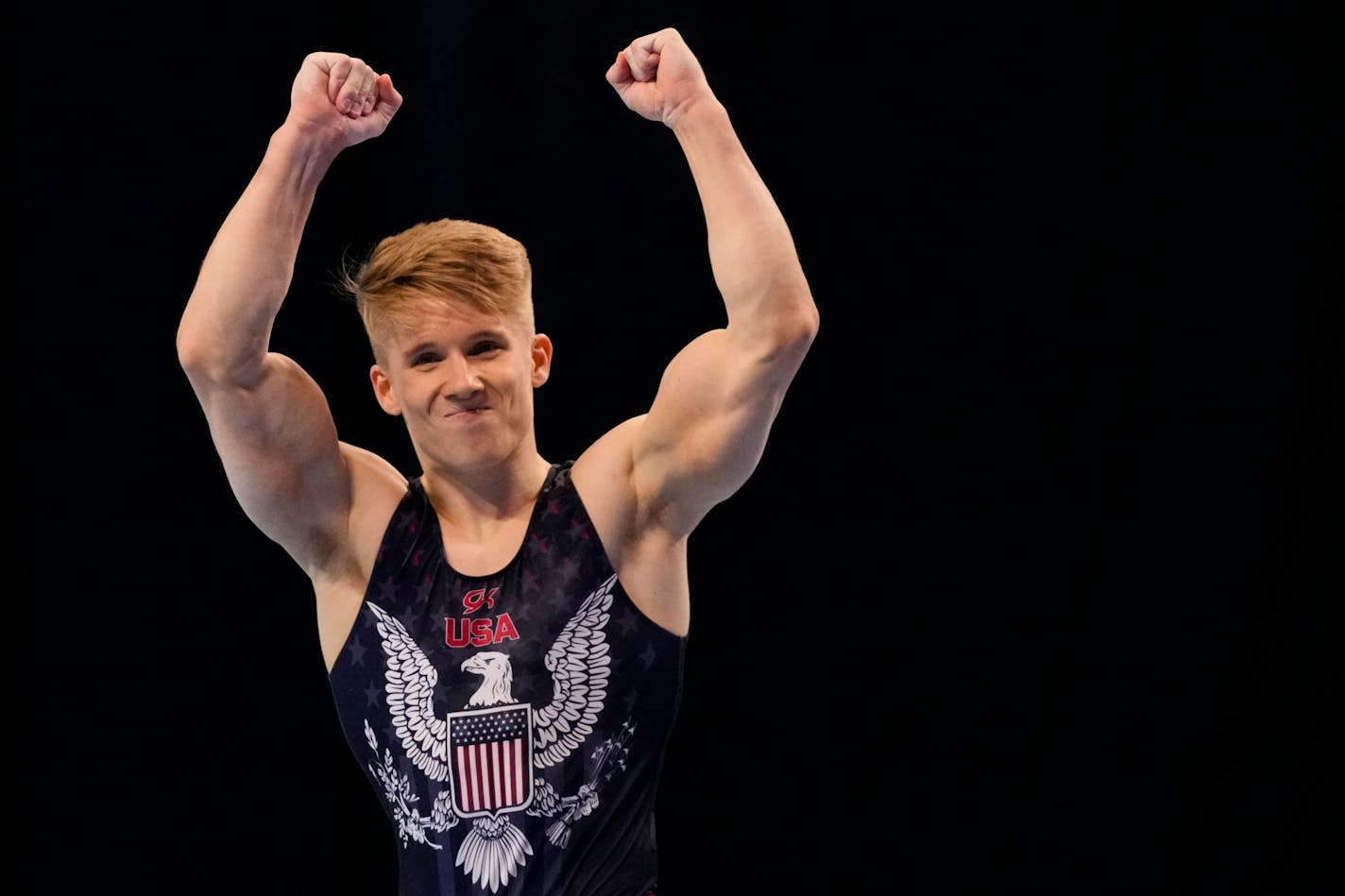 Shane Wiskus celebrates after competing in the floor exercise during the men's U.S. Olympic Gymnastics Trials Saturday, June 26, 2021, in St. Louis. (AP Photo/Jeff Roberson)