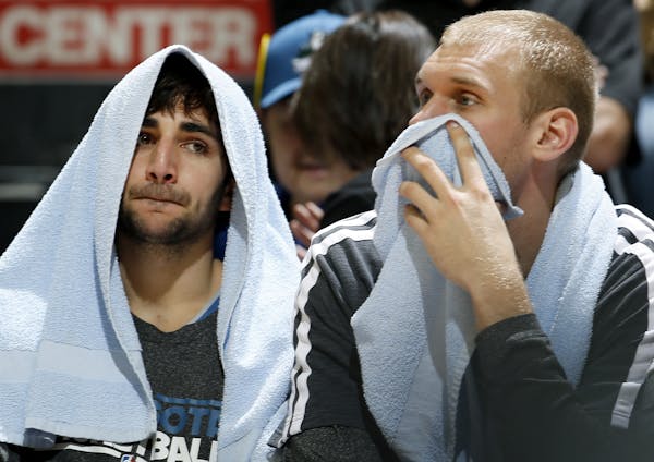 Ricky Rubio, left, and Greg Stiemsma sat on the bench in the final minutes of the Wolves' 96-80 loss to Utah in the team's final home game of the seas