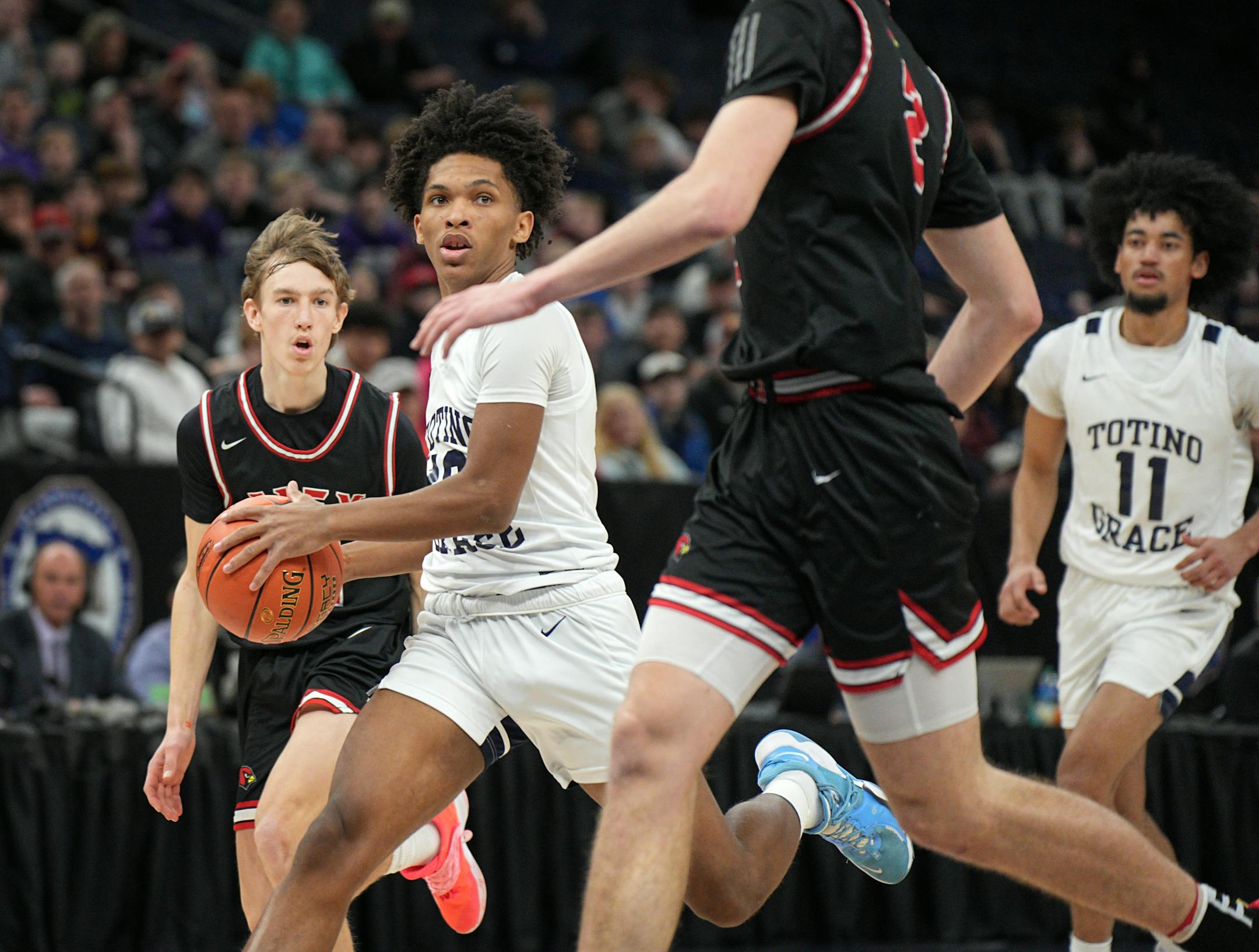 Totino-Grace's Pierless Davis drove to the basket in the second half.