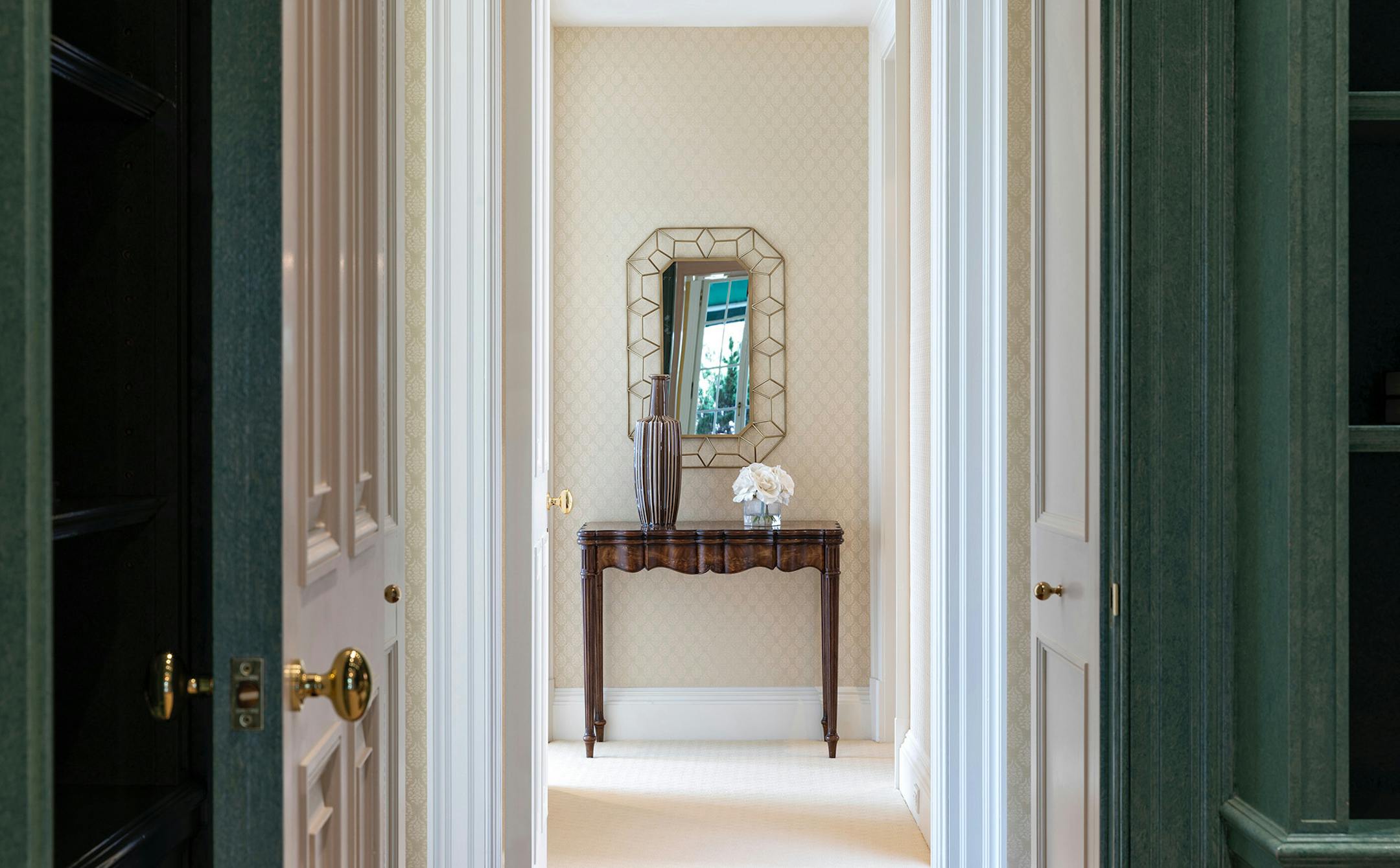 A mirror at the end of a hallway creates a visual focus. (Design Recipes/TNS)