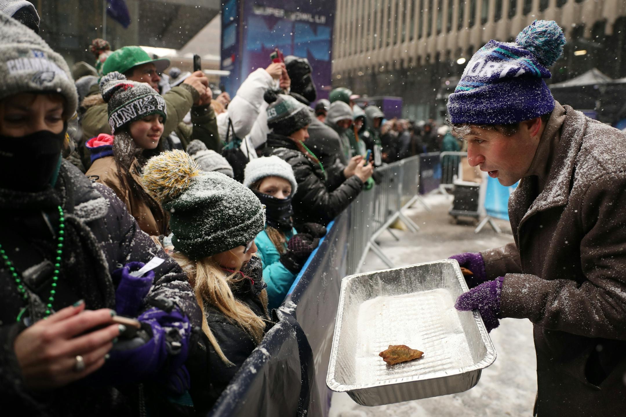 In classic Minnesota fashion, Minneapolis Mayor Jacob Frey had a hard time getting rid of the last sambusa from restaurant Afro Deli, as he passed them out to Philadelphia Eagles fans during their rally.