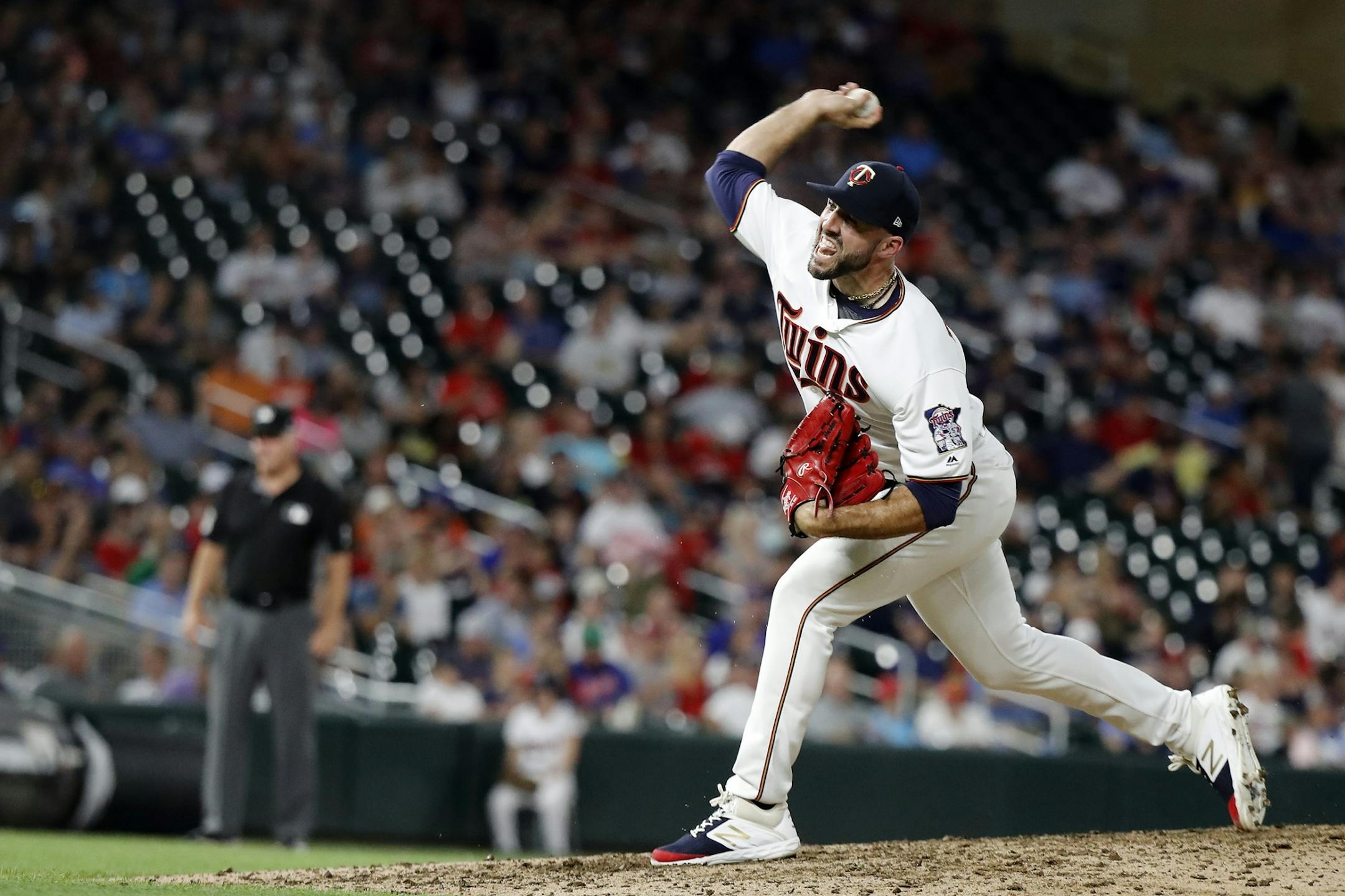 Minnesota Twins relief pitcher Blake Parker (38) pitches.