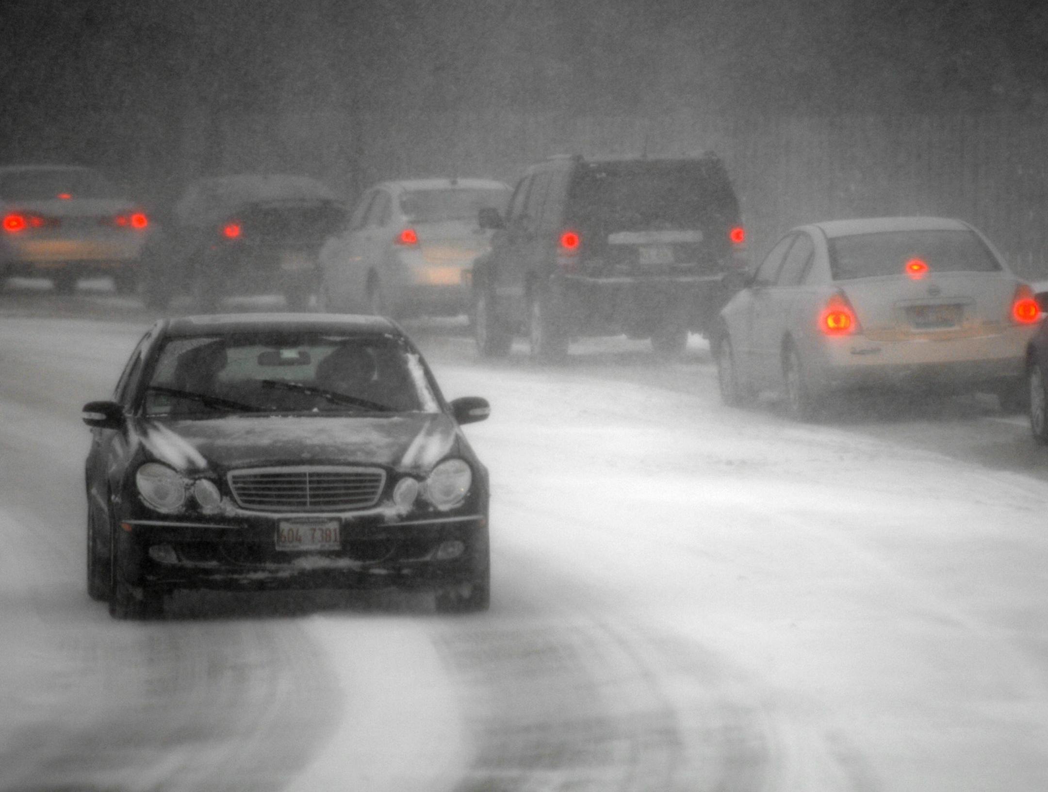 File photo: A driver breaks a cardinal rule of the road by not driving with headlights on in bad conditions.