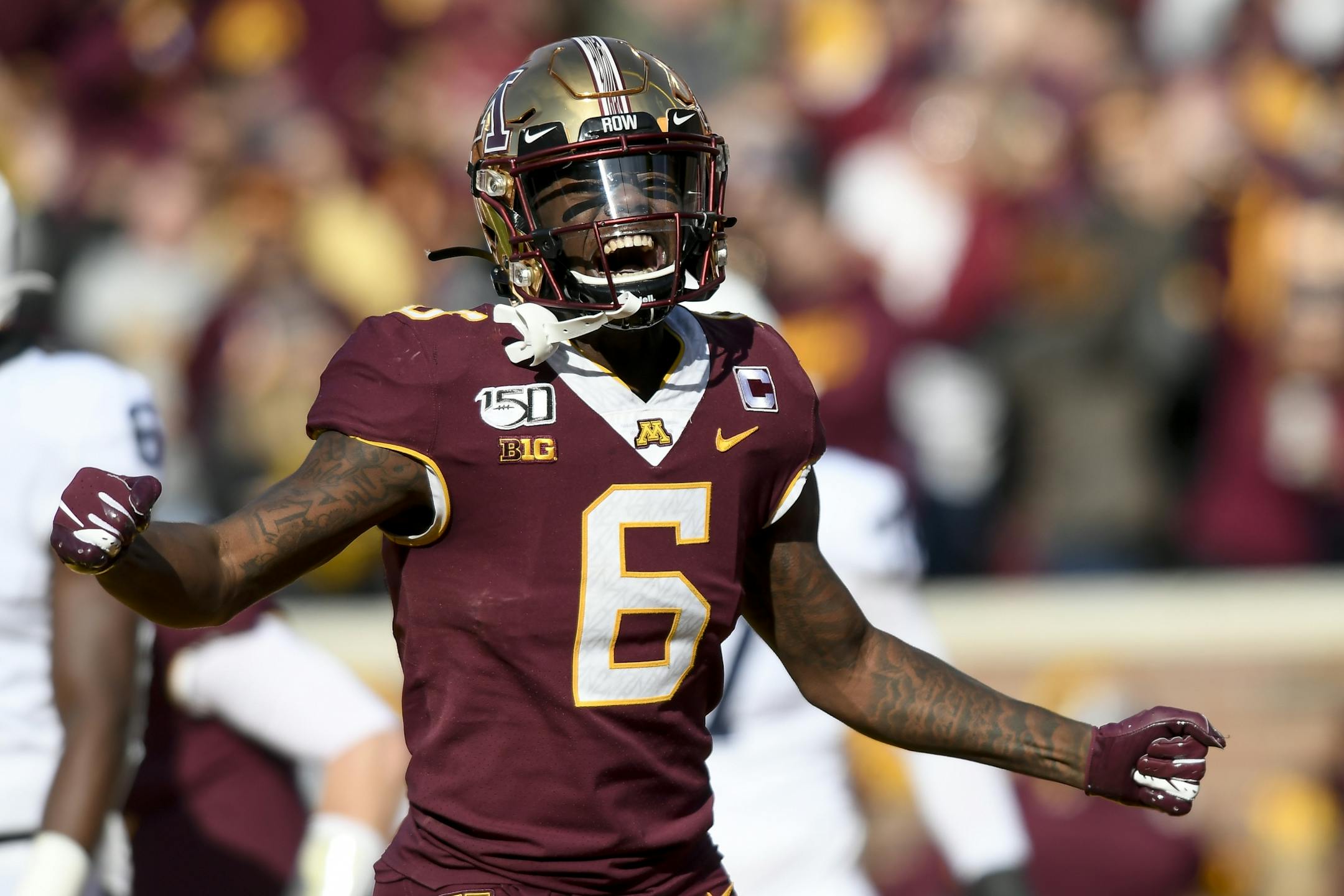 Minnesota Gophers wide receiver Tyler Johnson (6) celebrated a touchdown by Minnesota Gophers wide receiver Chris Autman-Bell (7) in the first half.