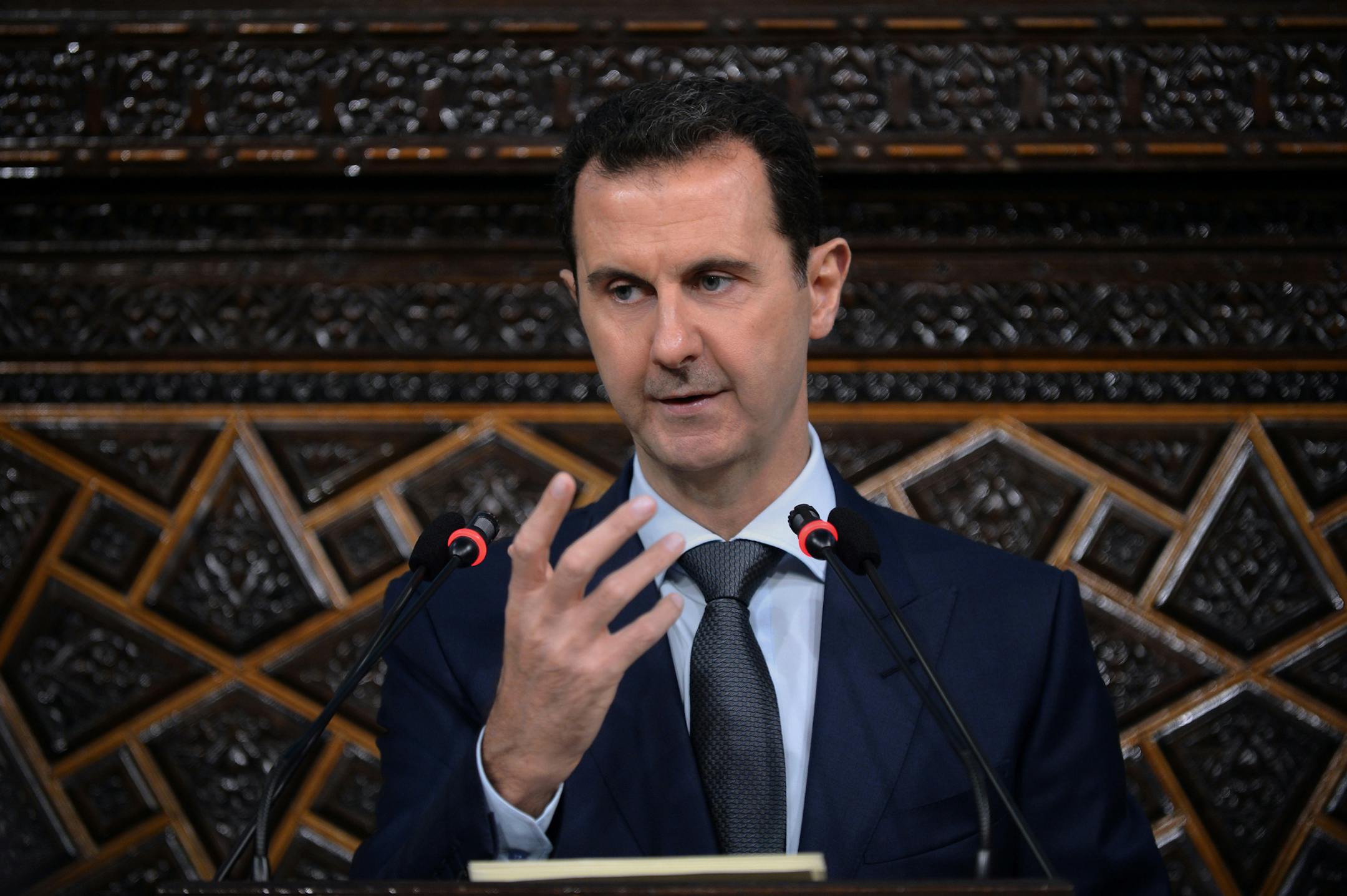 In this photo released by the Syrian official news agency SANA, Syrian President Bashar Assad, addresses a speech to the newly-elected parliament at the parliament building, in Damascus, Syria, Tuesday, June 7, 2016. Assad has vowed to liberate every inch of the country the way government forces captured the historic town of Palmyra from the Islamic State group. (SANA via AP)