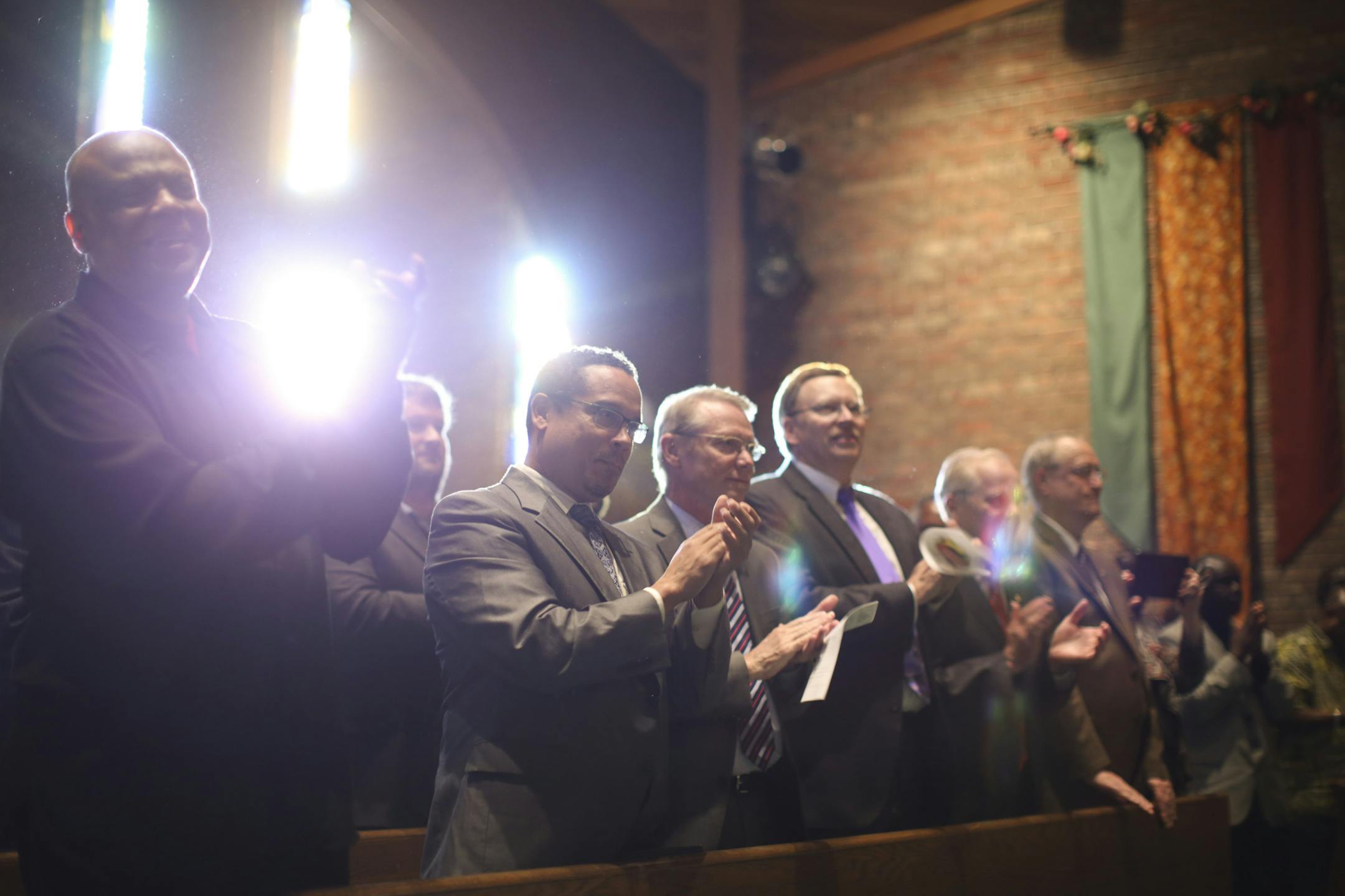 The front row of the church clapped along with the singing of the Community Worship Team Sunday afternoon at Cross of Glory Lutheran Church in Brooklyn Center. From left were Alfred. Babington-Johnson, Congressman Keith Ellison, and state Rep. Ray Dehn. ] JEFF WHEELER ‚Ä¢ jeff.wheeler@startribune.com The Liberian community in the Twin Cities hosted a memorial service Sunday afternoon, October 19, 2014 at Cross of Glory Lutheran Church in Brooklyn Center for Thomas Eric Duncan, t