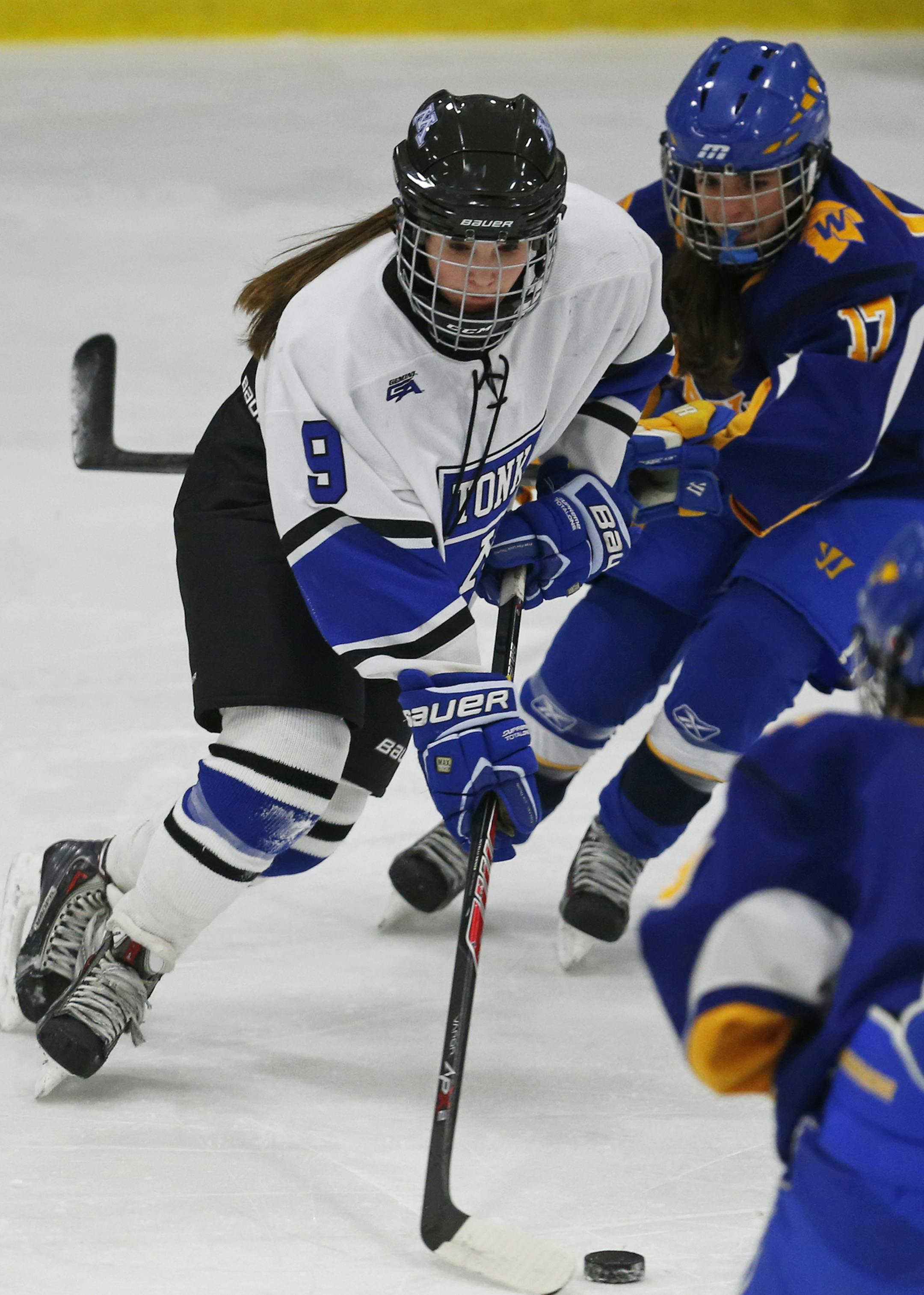 At Minnetonka H.S. in a girls hockey game against Wayzata, Annelise Rice(1) controls the puck as Izzy Shannon(17) of Wayzata gives chase.]richard tsong-taatarii/rtsong-taatarii@startribune.com