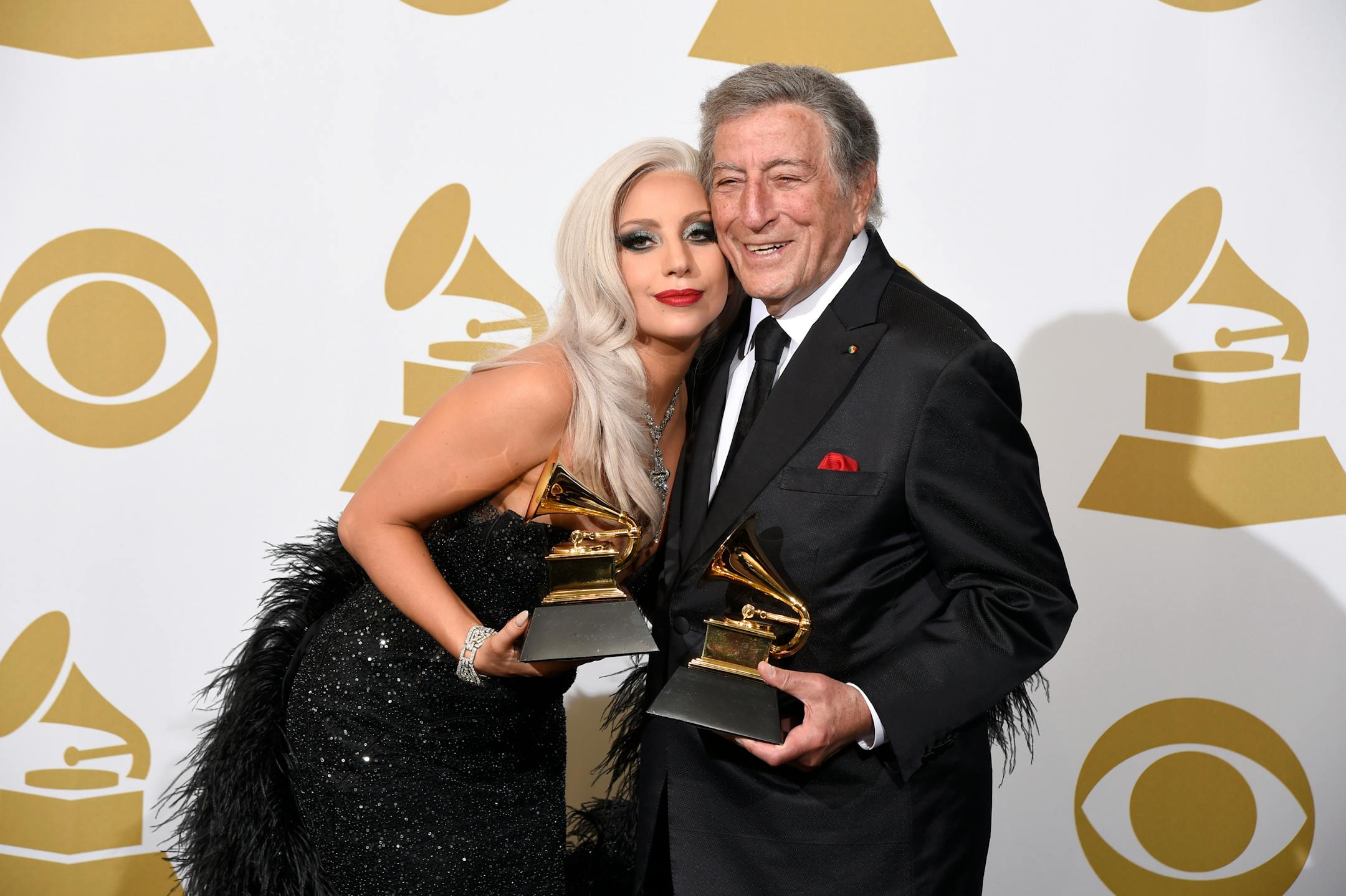 Lady Gaga, left, and Tony Bennett pose in the press room with the award for the best traditional pop vocal album for "Cheek to Cheek" at the 57th annual Grammy Awards at the Staples Center on Sunday, Feb. 8, 2015, in Los Angeles.