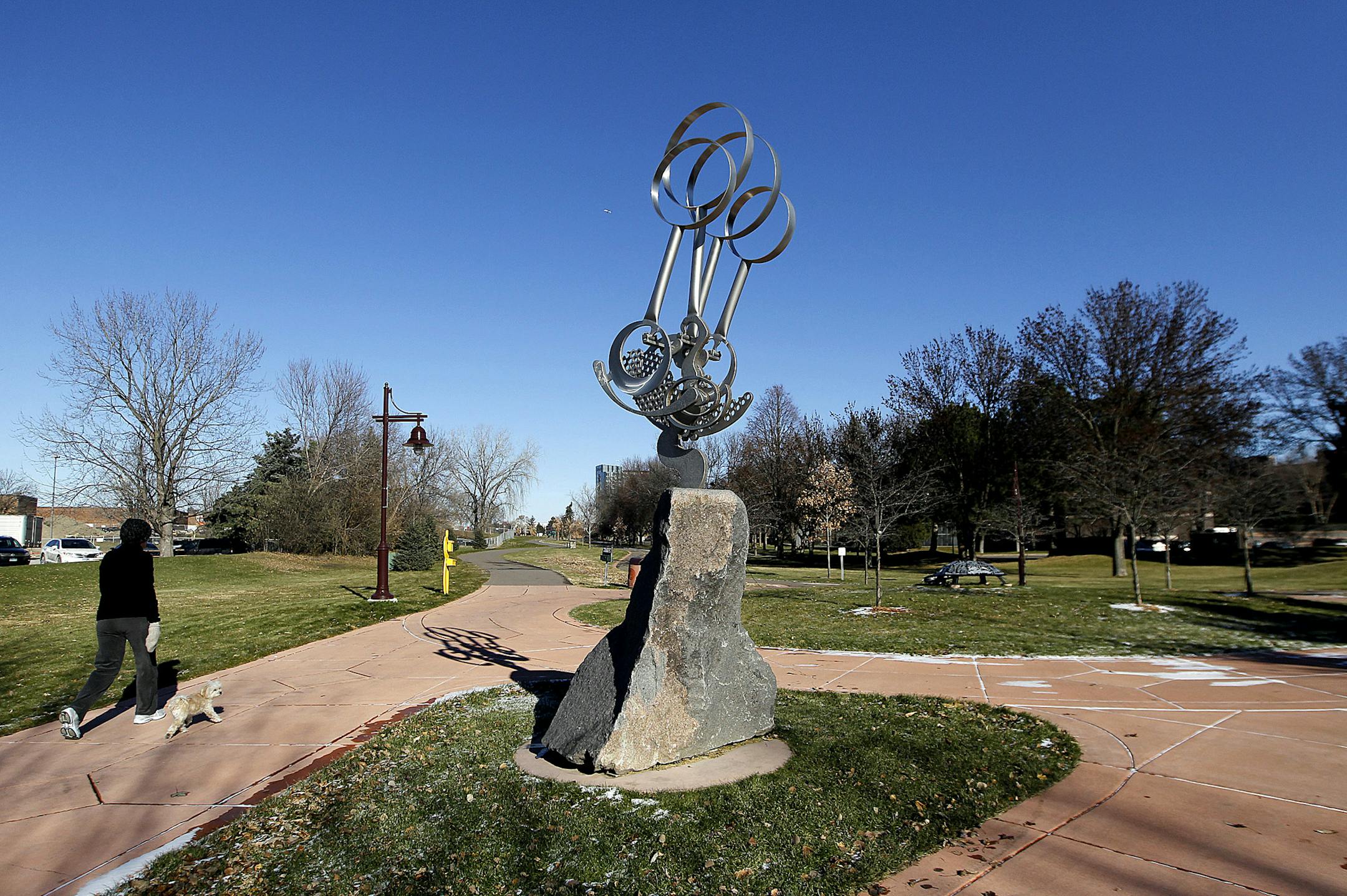 Walkers made their way along the Promenade bike and walking trail, Friday, November 22, 2013 in Edina, MN. Edina council will be looking at plans for the final phase of the Promenade, the walking and biking trail that runs north of Centennial Lakes to the Galleria/Target area. The trail, which is lined by sculptures, is getting a water feature that is linked to a building project in the area and also is supposed to improve storm water handling in the area. (ELIZABETH FLORES/STAR TRIBUNE) ELIZABE