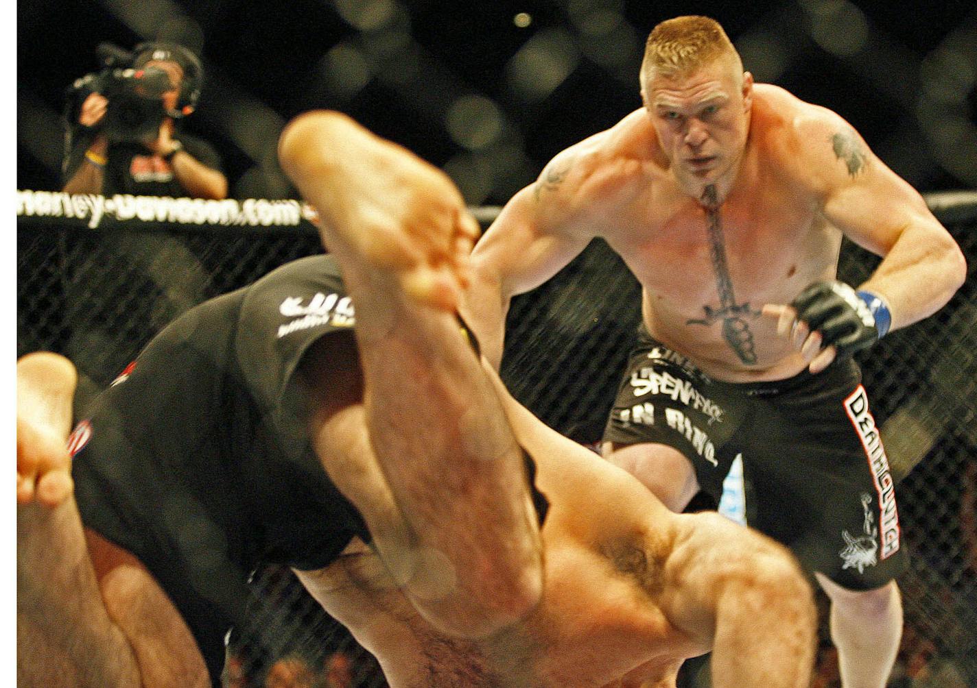 MARLIN LEVISON * mlevison@startribune.com Assign. #00004252A August 9, 2008] - GENERAL INFORMATION: UFC fight card. IN THIS PHOTO: Brock Lesnar (blonde crew cut) fought Heath Herring (dark hair and facial hair) in the heavyweifght division. Lesnar went after Herring after knocking him down in the first round.