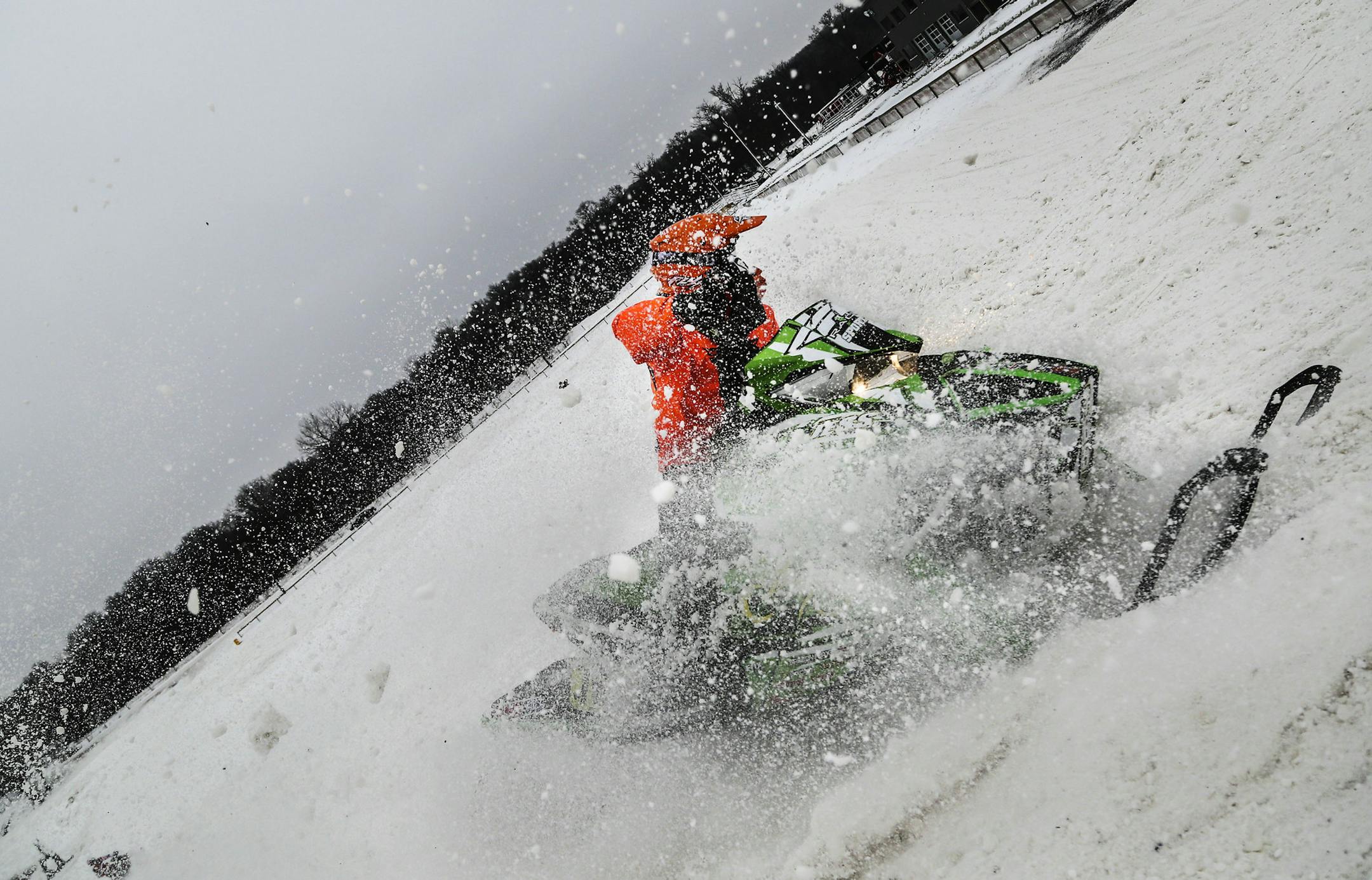 In the cold of winter ERX Motor Park in Elk River is a hotbed for snowcross, a type of snowmobile racing. Even on non-race days, up to 80 competitors plunk down up to $100 to practice on the course. Here, snow flies as a snocross competitor takes a corner while practicing Wednesday, Dec. 10, 2014, in Elk River, MN.](DAVID JOLES/STARTRIBUNE)djoles@startribune.com ERX Motor Park in Elk River is a hotbed for snowcross, a type of snowmobile racing. Even on non-race days, up to 80 competitors plunk d