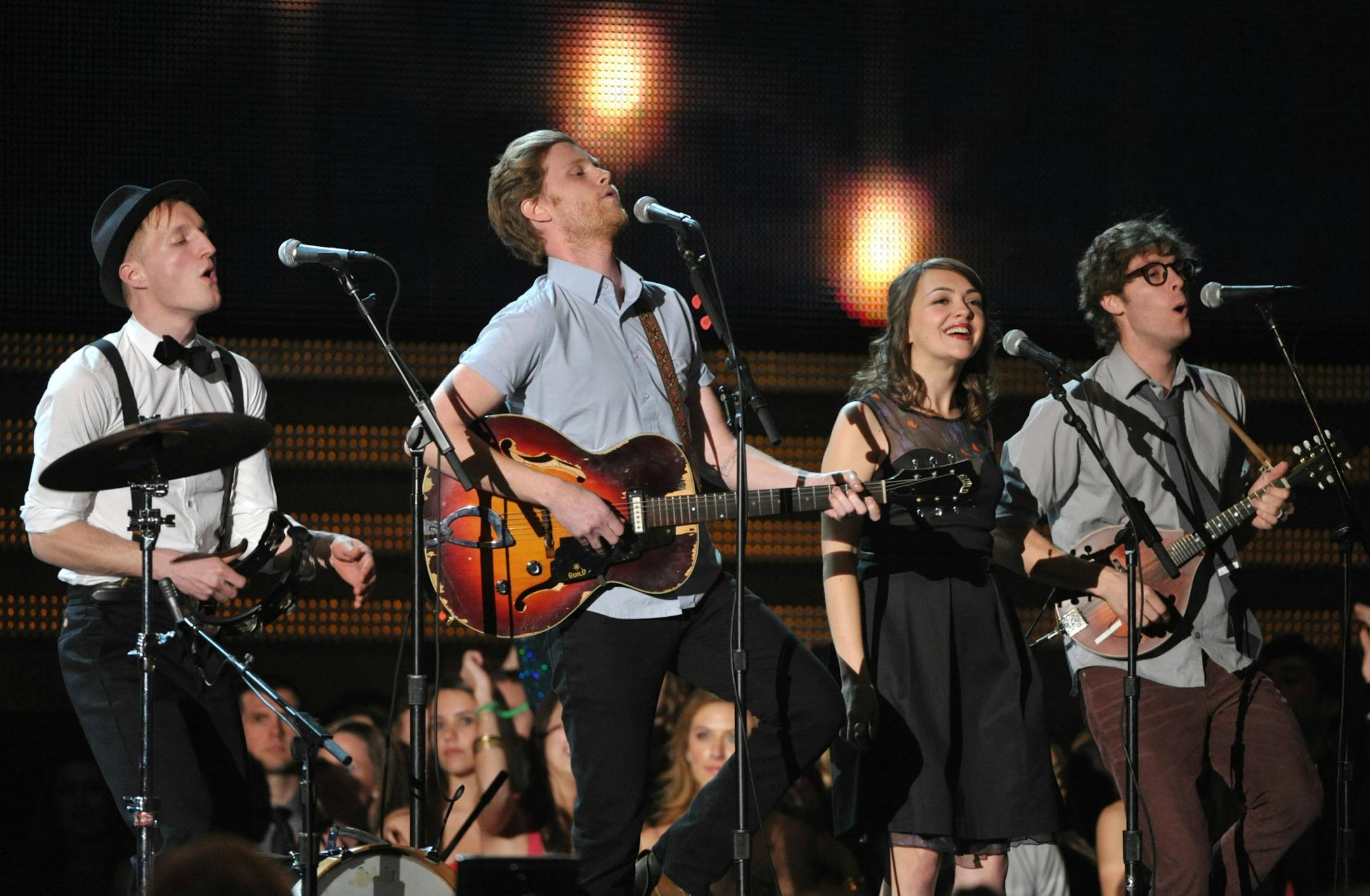 The Lumineers, from left, Jeremiah Fraites, Wesley Schultz, Neyla Pekarek and Stelth Ulvang perform at the 55th annual Grammy Awards on Sunday, Feb. 10, 2013, in Los Angeles.
