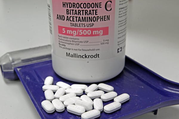 Hydrocodone bitartrate and acetaminophen pills, also known as Vicodin.