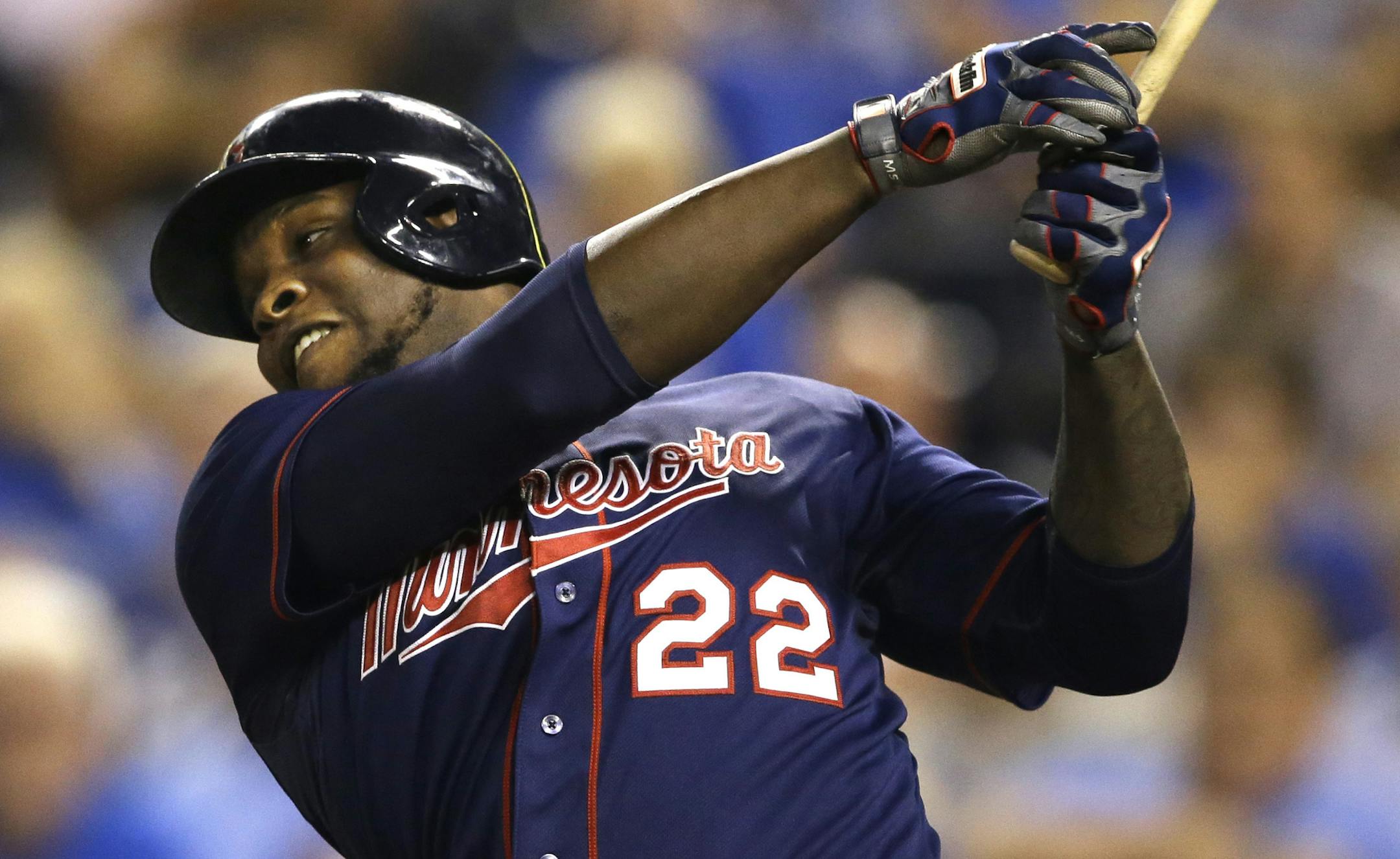 Minnesota Twins designated hitter Miguel Sano watches a solo home run off Kansas City Royals relief pitcher Franklin Morales during the 12th inning of a baseball game at Kauffman Stadium in Kansas City, Mo., Wednesday, Sept. 9, 2015. The Twins defeated the Royals 3-2 in 12 innings. (AP Photo/Orlin Wagner)
