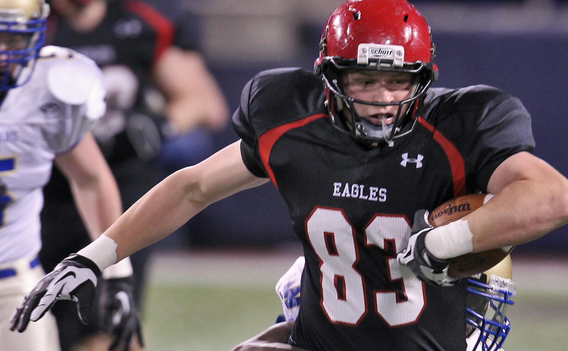 PREP FOOTBALL Class 6A Tournament. Eden Prairie vs. Wayzata. Eden Prairie's Zach Hovey (83) carried Wayzata tacklers with him after making a first half reception. (MARLIN LEVISON/STARTRIBUNE(mlevison@startribune.com (cq all names program ORG XMIT: MIN1211162140480038