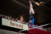 Jackie Bergeron of St. Michael-Albertville held a handstand on the uneven bars on her way to the Class 2A all-around title.