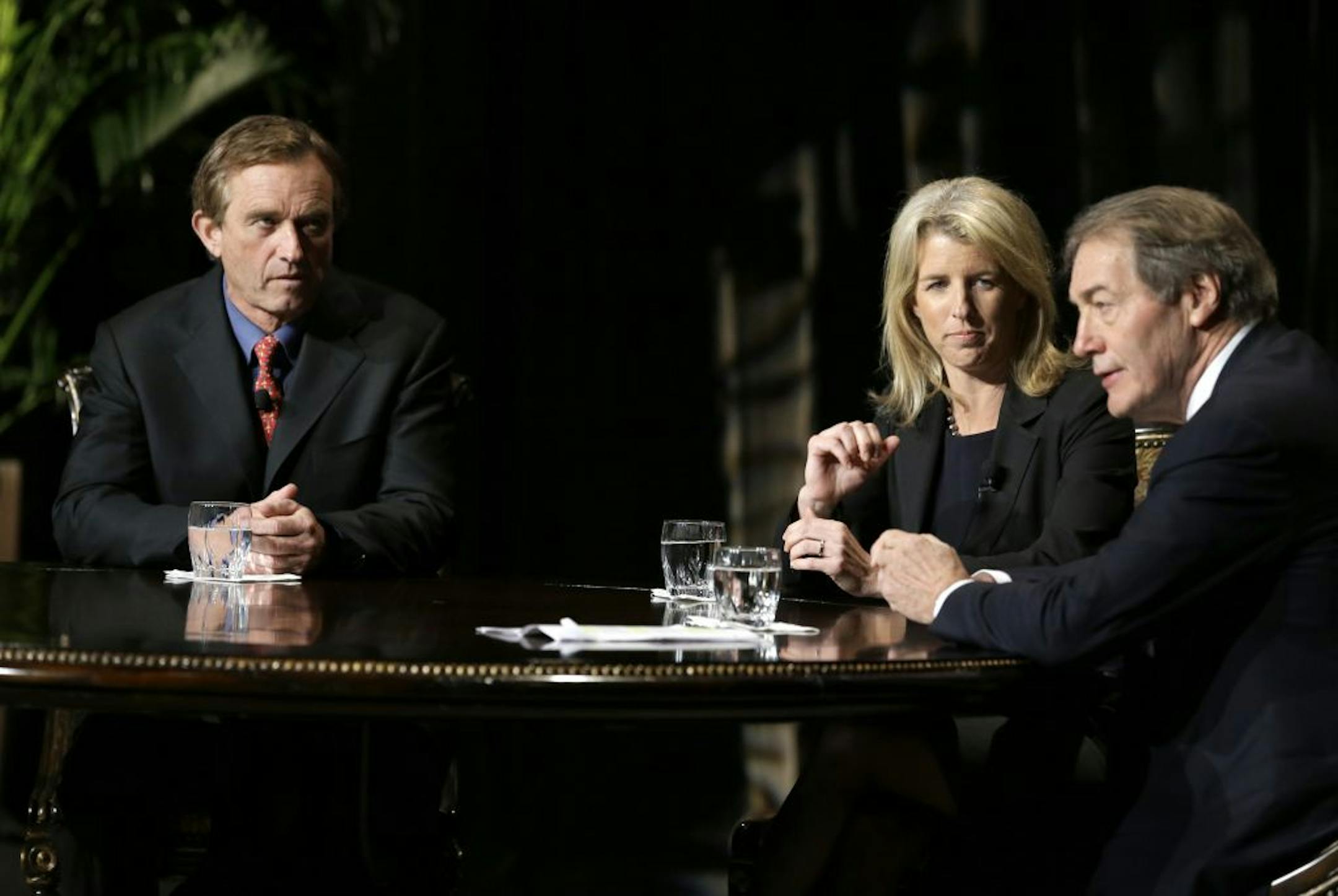 Journalist Charlie Rose, right, makes opening comments as Rory Kennedy, center, and Robert F. Kennedy Jr., left, look on before Rose conducted an interview in front of a full audience at the AT&T Performing Arts Center Friday, Jan. 11, 2013, in Dallas. The Kennedys are in Dallas as a year of observances begins for the 50th anniversary of President John F. Kennedy's assassination.