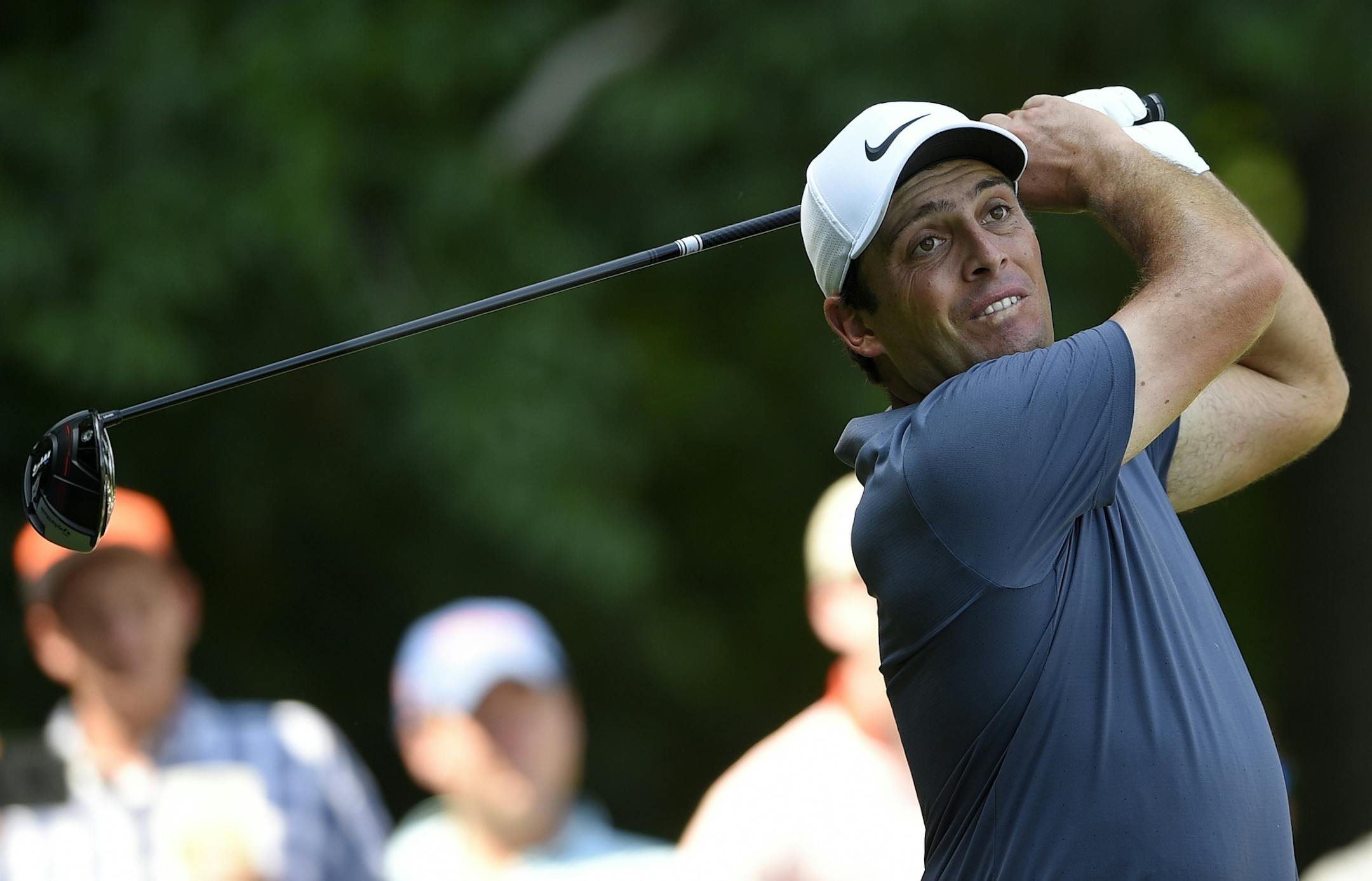 Francesco Molinari, of Italy, watches his tee shot on the eighth tee during the final round of the Quicken Loans National golf tournament, Sunday, July 1, 2018, in Potomac, Md. (AP Photo/Nick Wass)