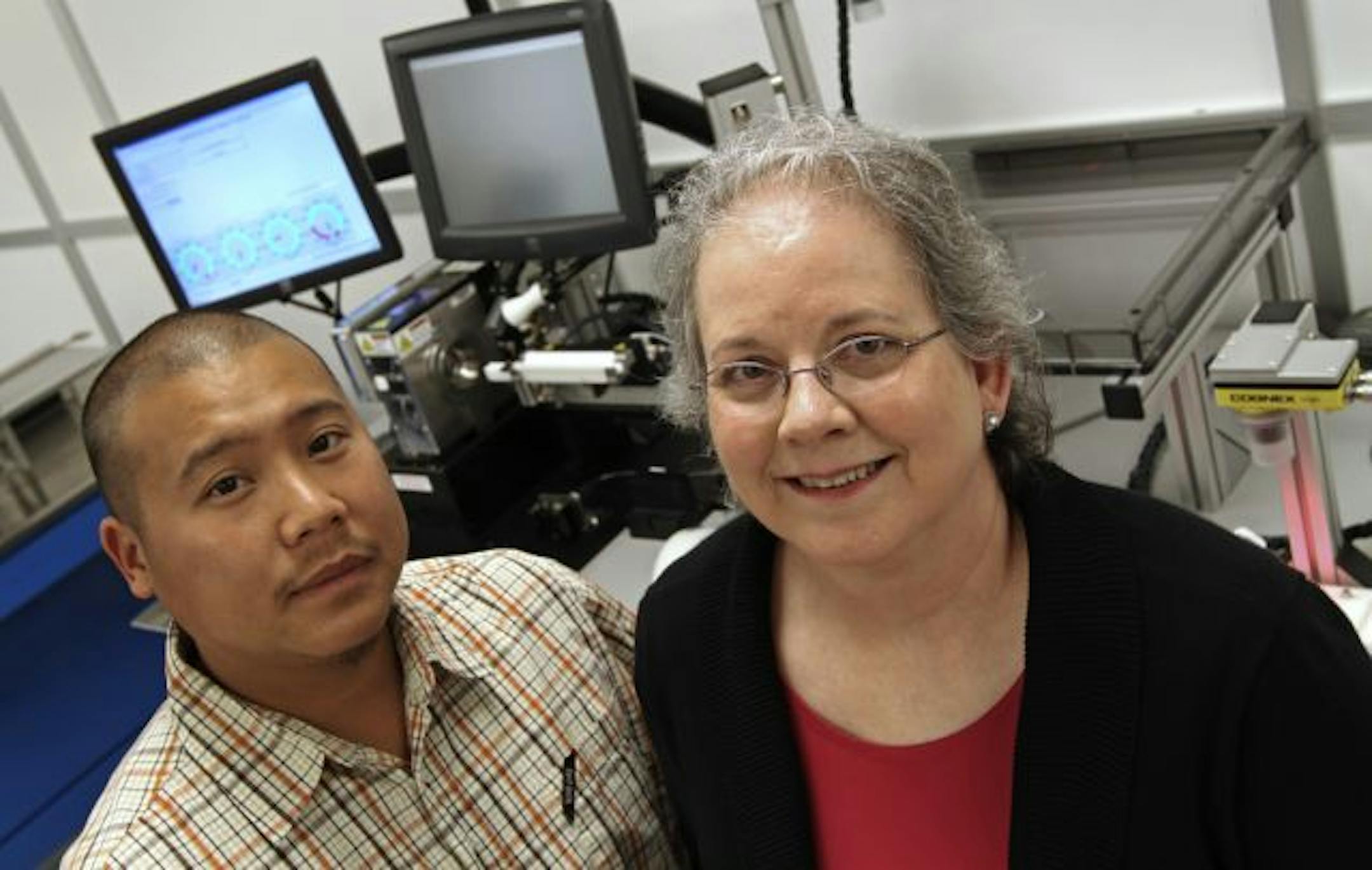 Now-retired Boston Scientific employee Carolynn Taplin was delighted to learn her friend on the manufacturing line, Shiong Vang, made the drug-coated stent that was implanted in her after her heart attack. Vang said he felt good about making the device that saved his friend's life.