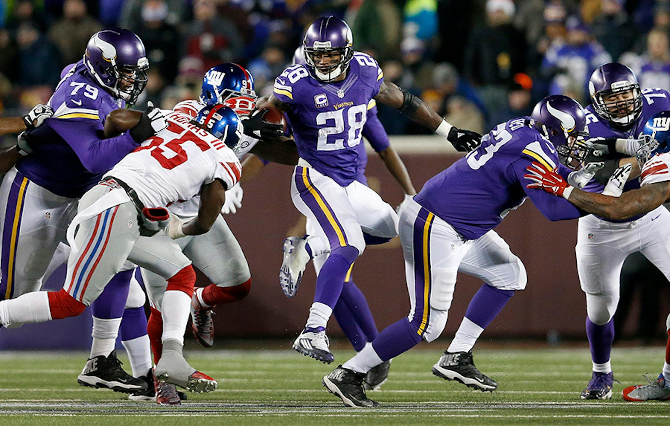Vikings running back Adrian Peterson (28) during a run in the first quarter.