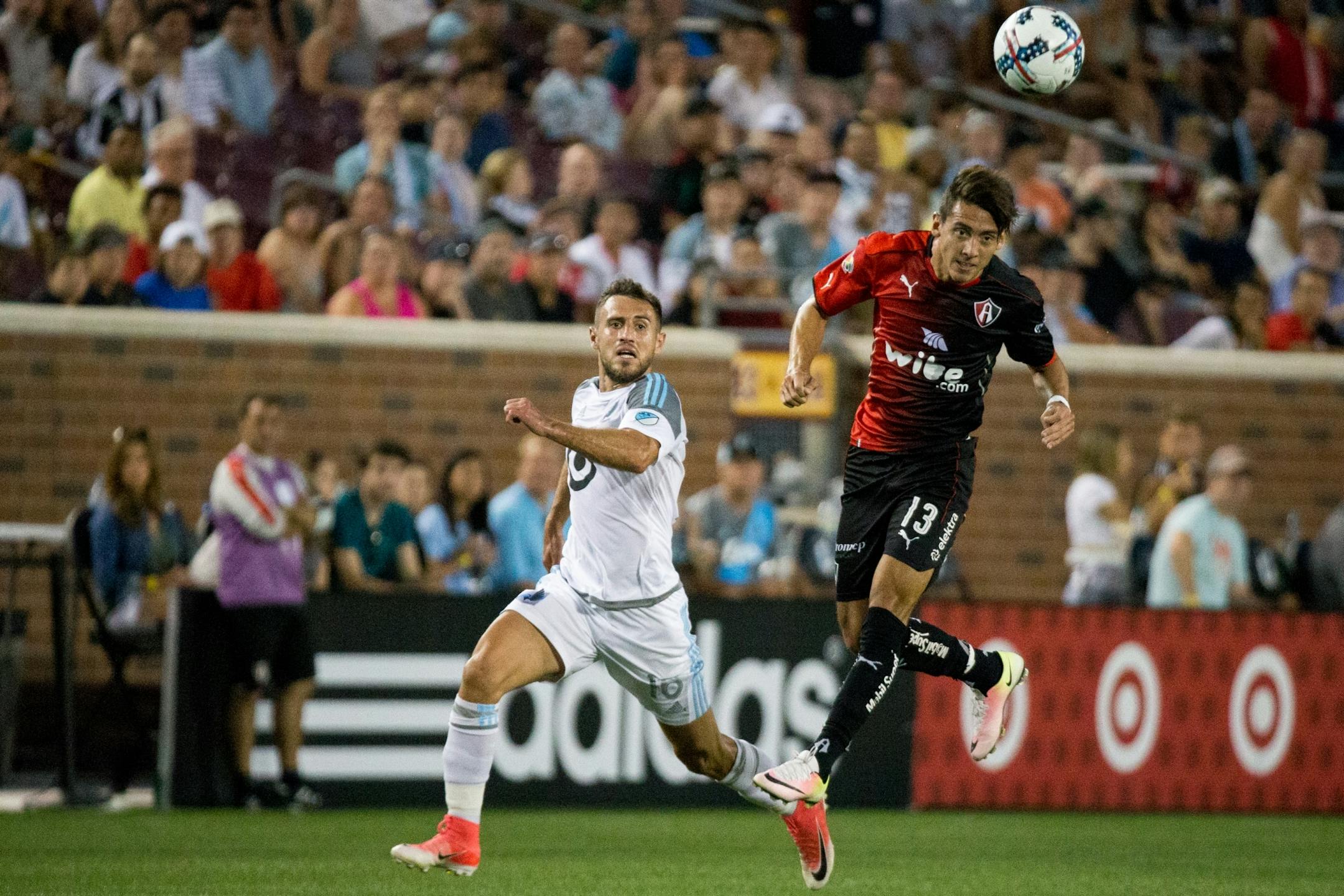 Atlas� Javier Salas heads the ball while Minnesota United�s Bashkim Kadrii watches during the second half on Saturday, July 15, 2017, at TCF Bank Stadium.