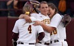 Gophers pitcher Amber Fiser (13) was congratulated by her teammates Carlie Brandt (4) and Hannah Bailey (70) after the win.