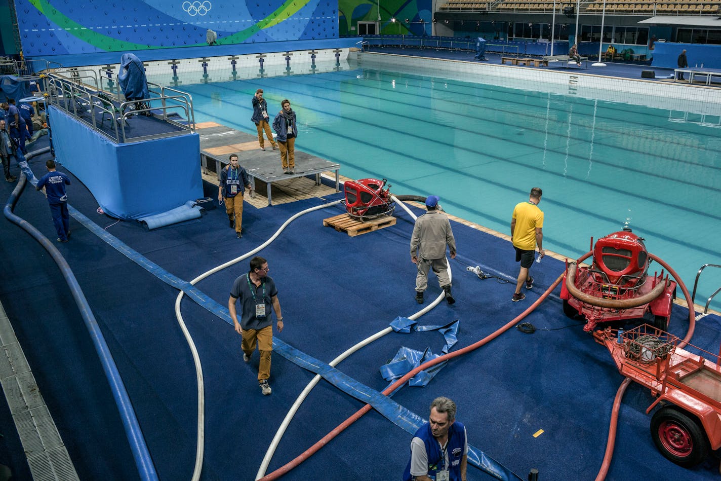 Olympic officials drained the green water from the water polo and synchronizing swimming pool at the 2016 Summer Olympics in Rio de Janeiro. Officials on Saturday gave what they said was a definitive explanation of why the water in two competition pools turned green this week: Someone mistakenly added 160 liters of hydrogen peroxide last Friday, neutralizing the chlorine and allowing the growth of organic compounds that might have included algae.