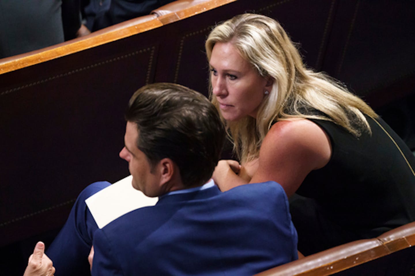 FILE - In this June 30, 2021, file photo, Rep. Matt Gaetz, R-Fla., left, and Rep. Marjorie Taylor Greene, R-Ga., sit in the House chamber during the vote to create a select committee to investigate the Jan. 6 insurrection, at the Capitol in Washington. A third event venue in California has canceled a Saturday, July 17, night rally by Republican House Reps. Gaetz and Taylor Greene. A spokesman for the city of Anaheim announced the latest cancellation on Saturday, hours before the rally was scheduled to begin. (AP Photo/J. Scott Applewhite, File)