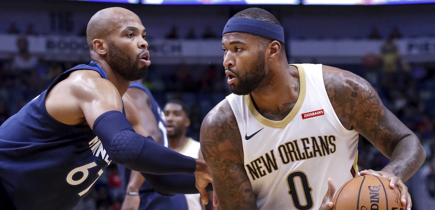 New Orleans Pelicans center DeMarcus Cousins (0) works against Minnesota Timberwolves forward Taj Gibson (67) in the first half of an NBA basketball game in New Orleans, Wednesday, Nov. 1, 2017. (AP Photo/Scott Threlkeld)