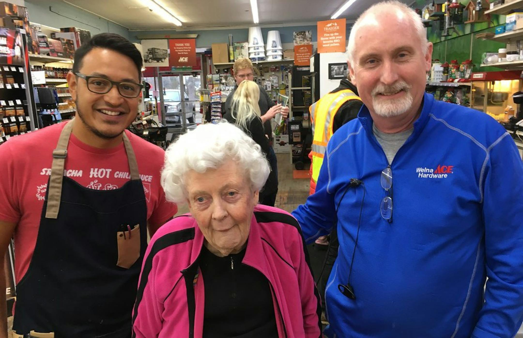 Mark Welna, right, shown in a 2019 file photo with his mother Pat Welna and customer Rolando Diaz of Marna's restaurant, at the Welna Hardware store in Robbinsdale. Now, customers aren't allowed in the store but Welna and his employees take orders at the door.